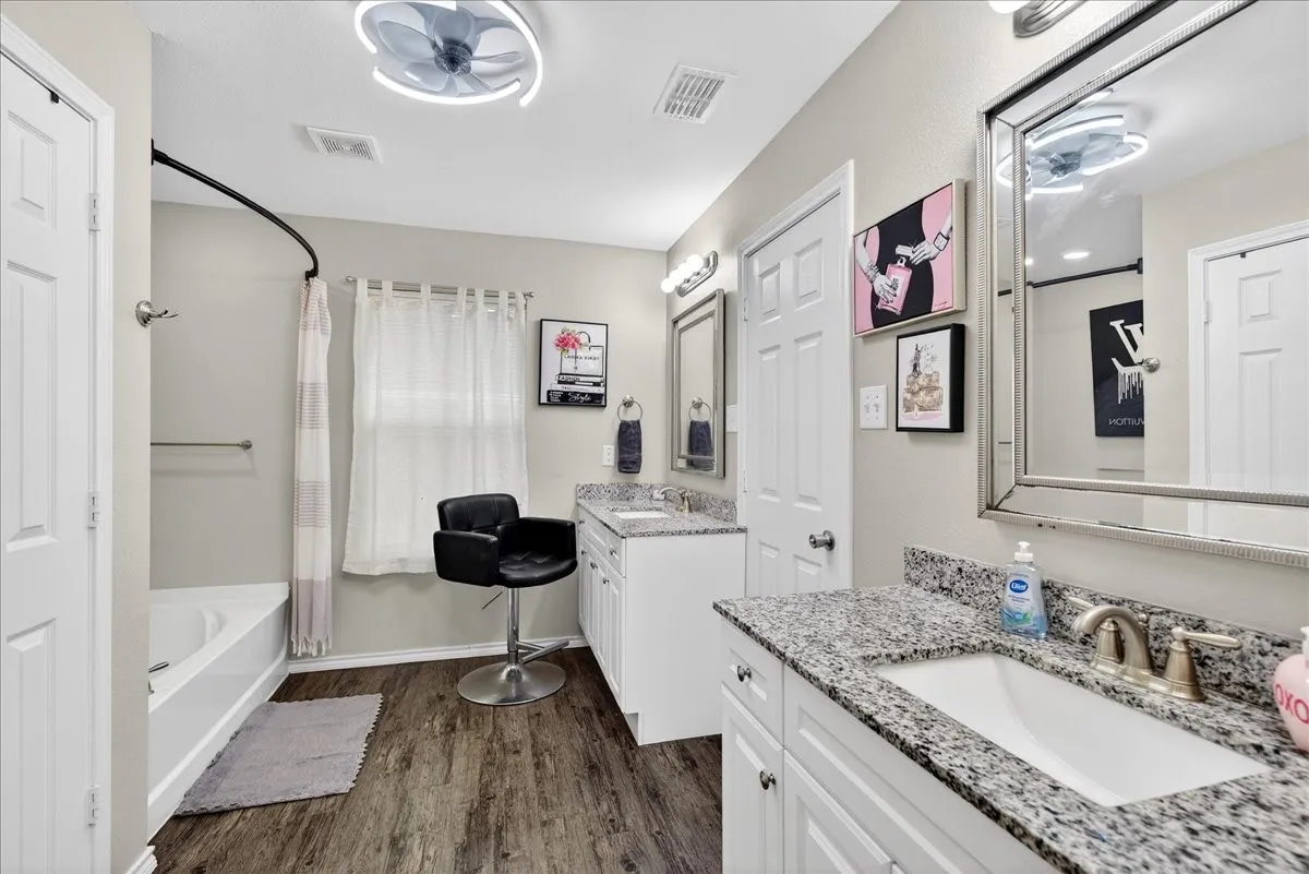Double vanities, soaking tub, separate shower and 2 walk in closets