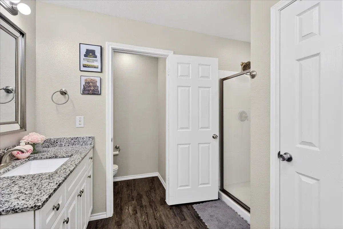 Double vanities, soaking tub, separate shower and 2 walk in closets