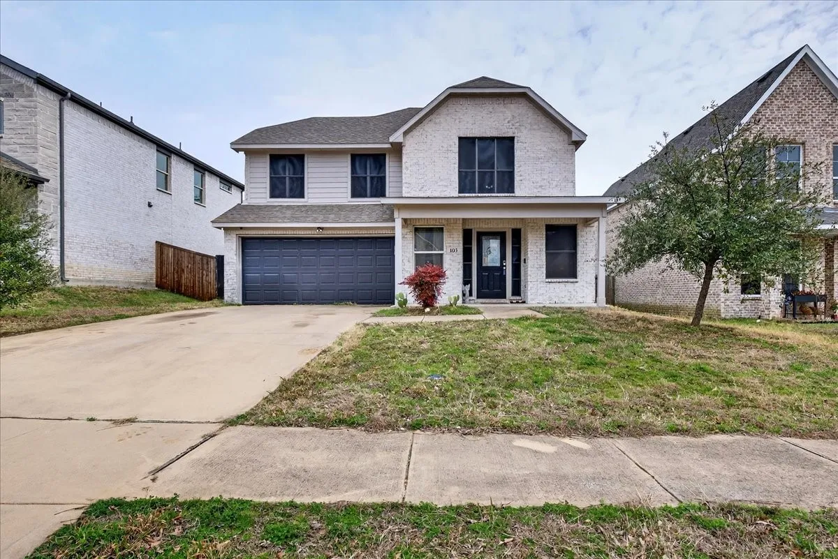 Front of the home highlighting the front covered porch