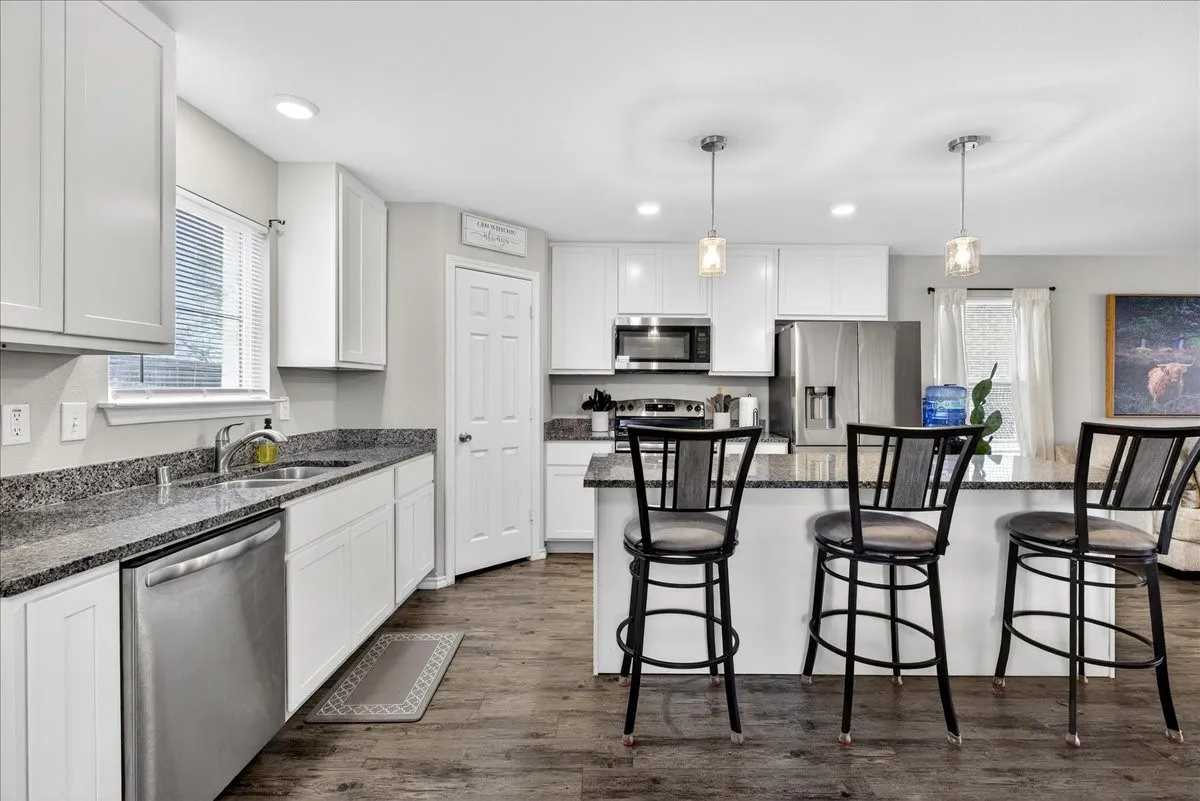 Kitchen highlighting the island with the breakfast bar area