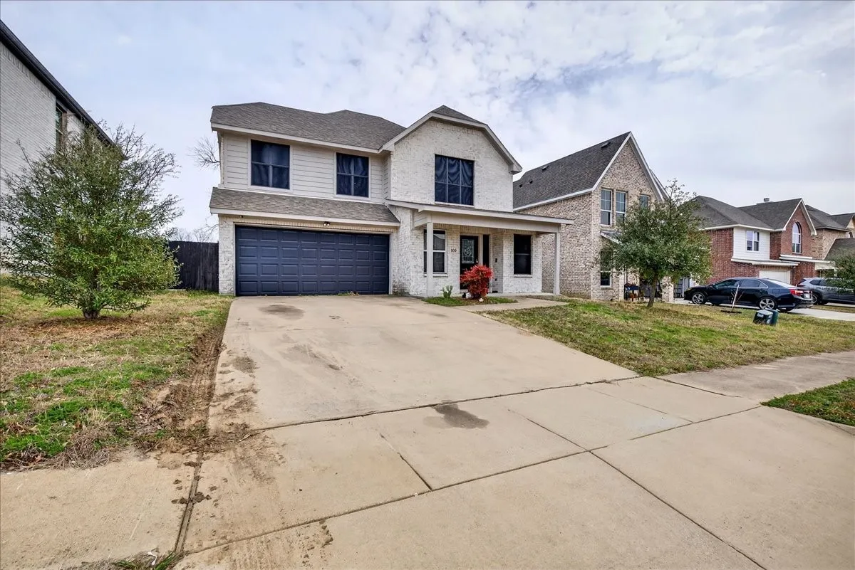 Front of the home highlighting the front covered porch