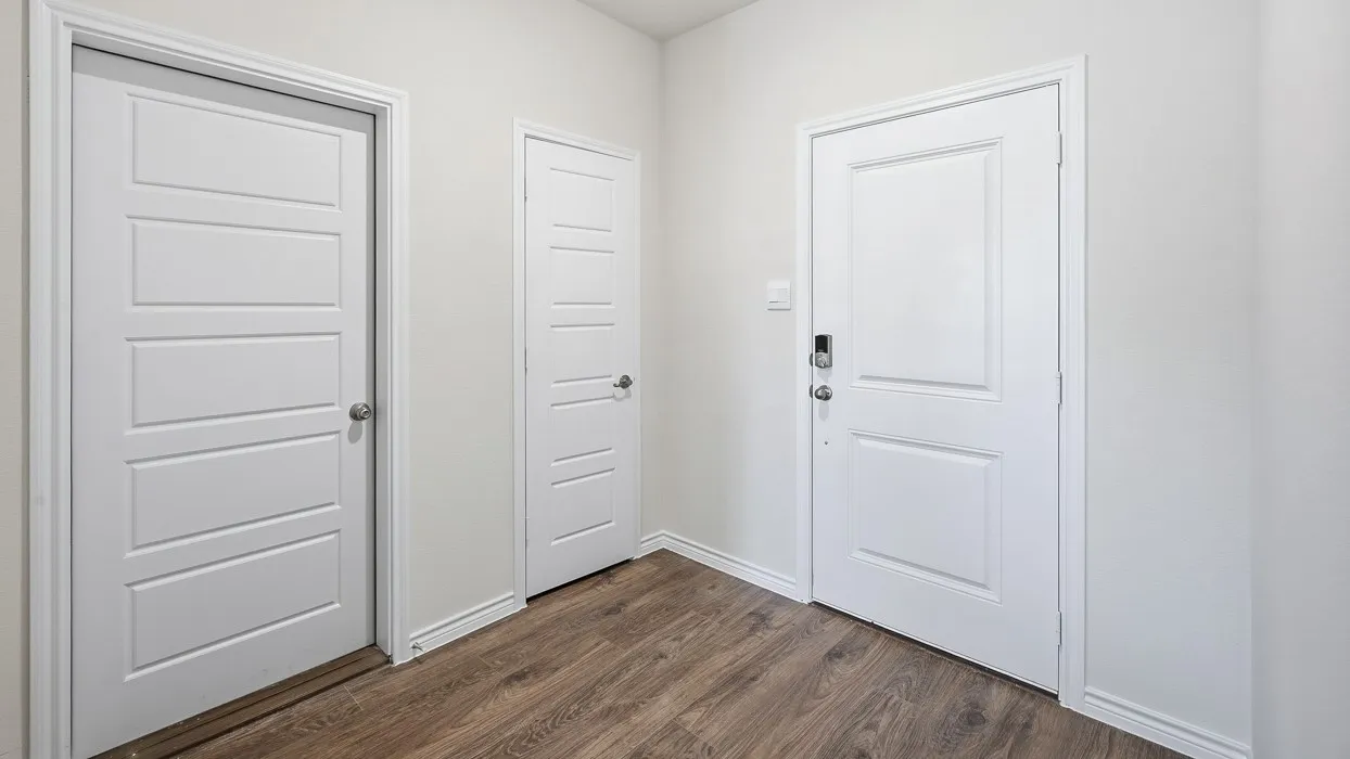 Doorway to outside featuring wood finished floors
