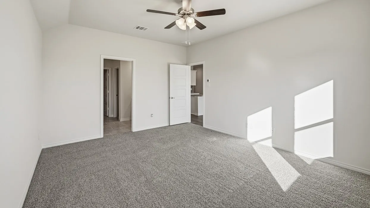 Unfurnished bedroom featuring carpet and ceiling fan