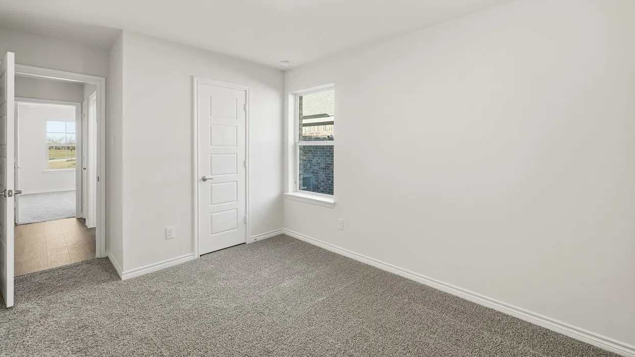 Unfurnished bedroom with carpet and a closet