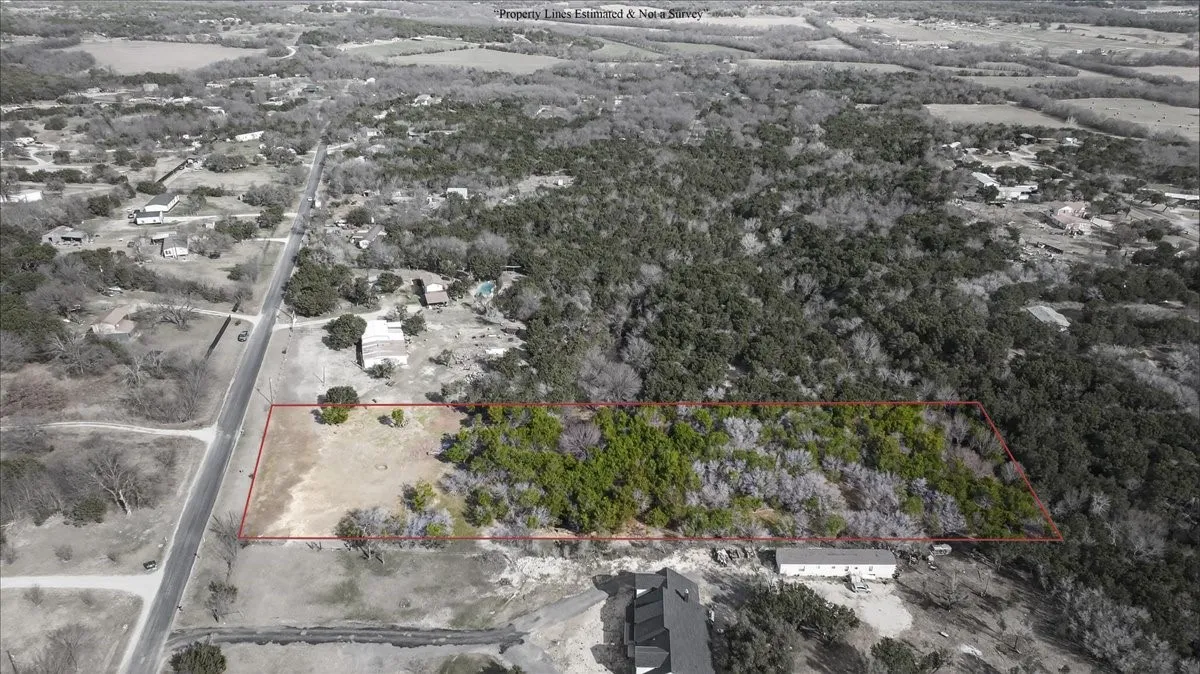 Aerial view of property and surrounding area with property boundaries highlighted