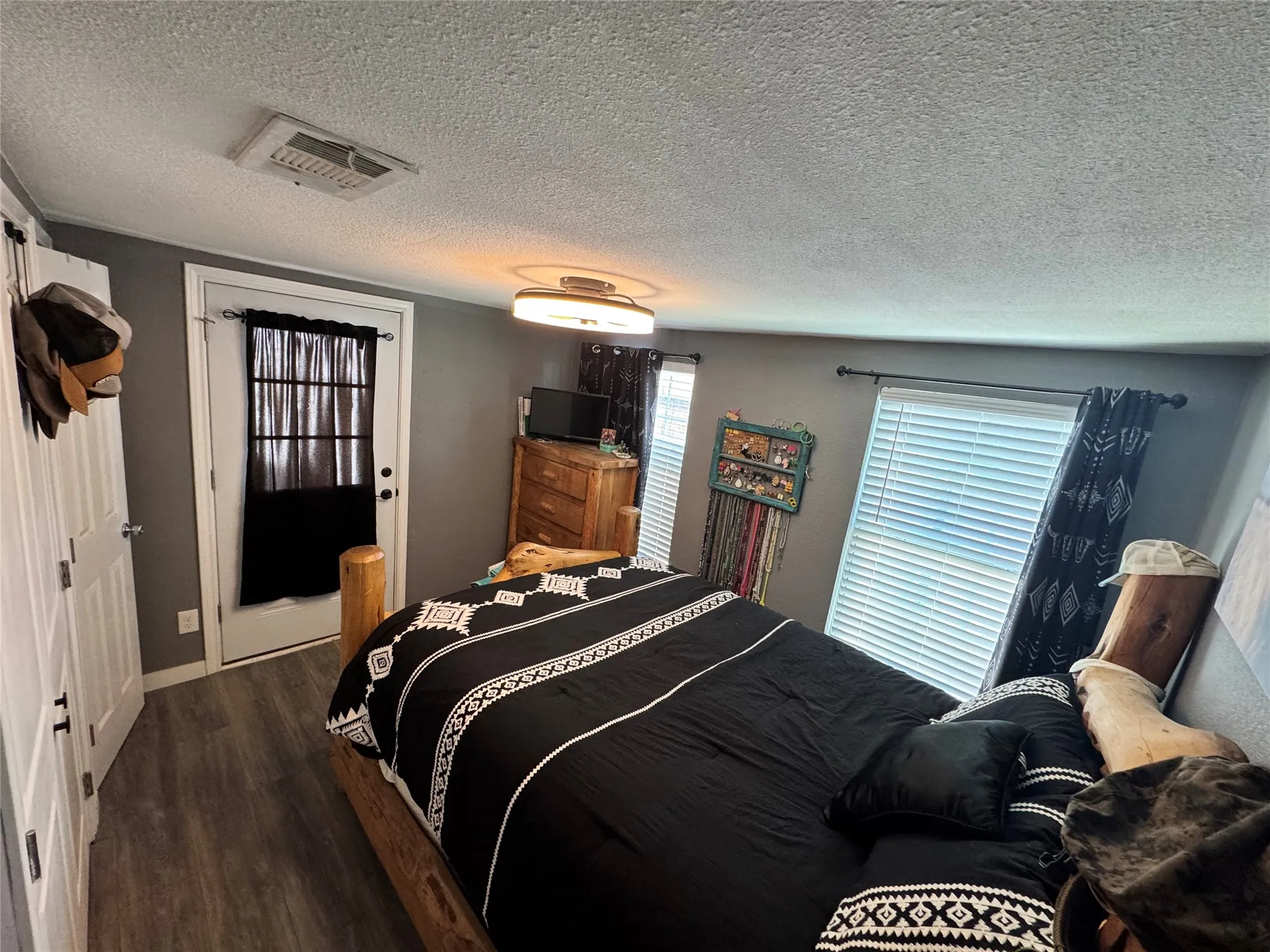 Bedroom with dark wood-style floors