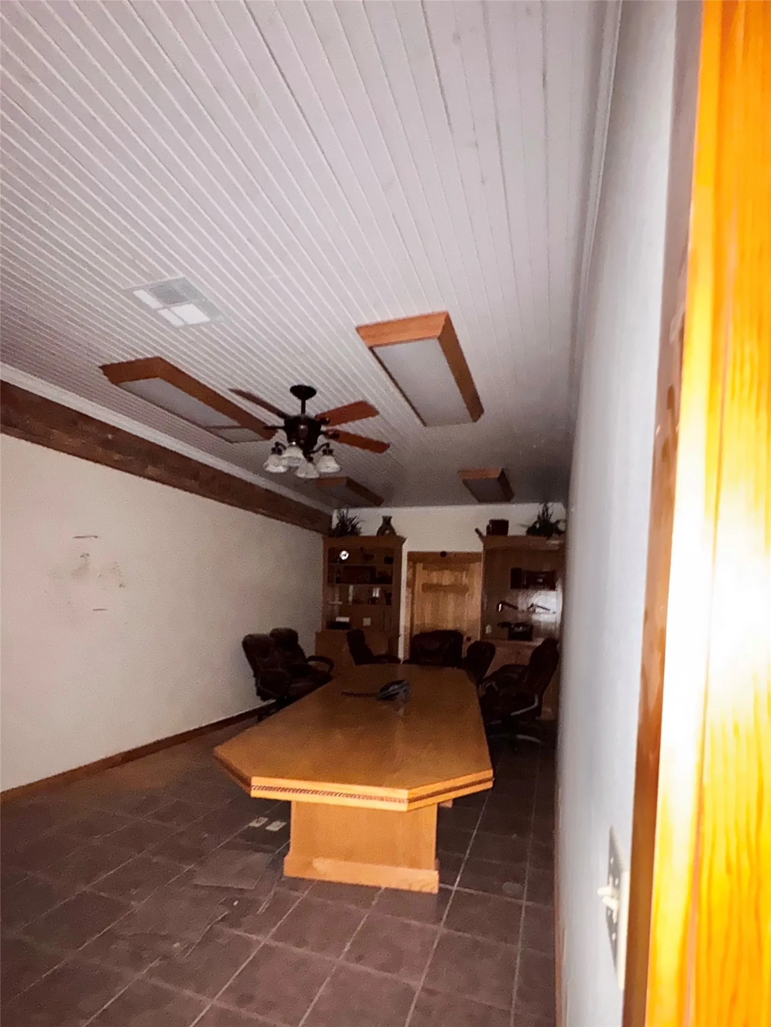 Oversized conference room with large conference table.