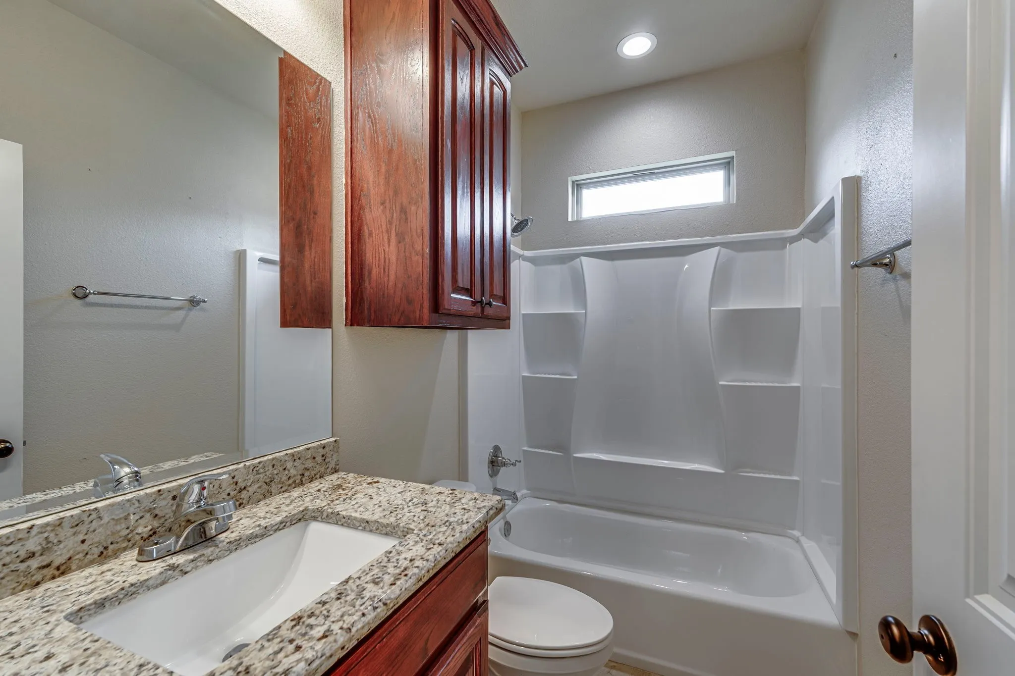Full bath featuring vanity and shower / washtub combination