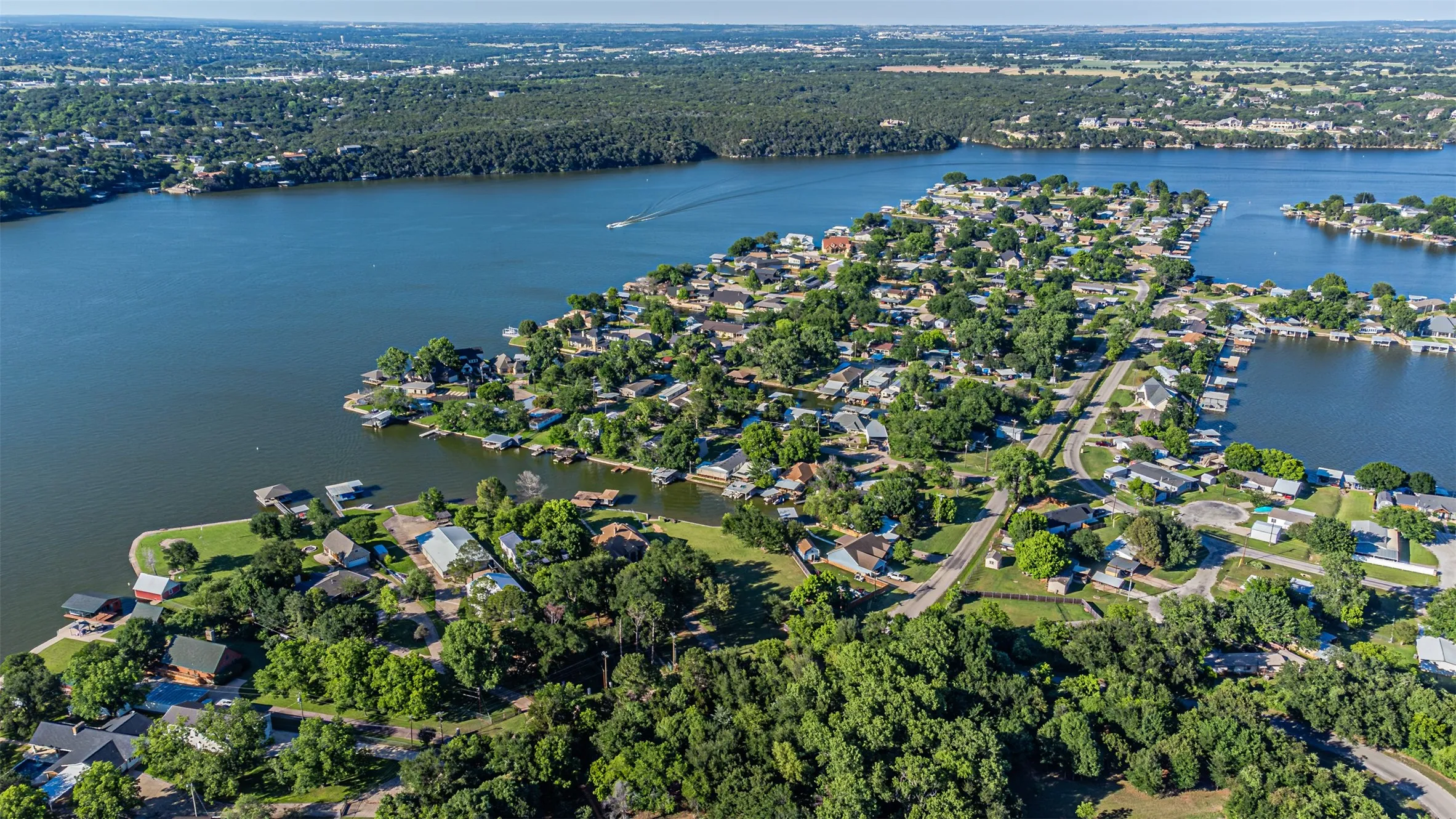 Aerial perspective showcasing a residential area with extensive waterfront properties