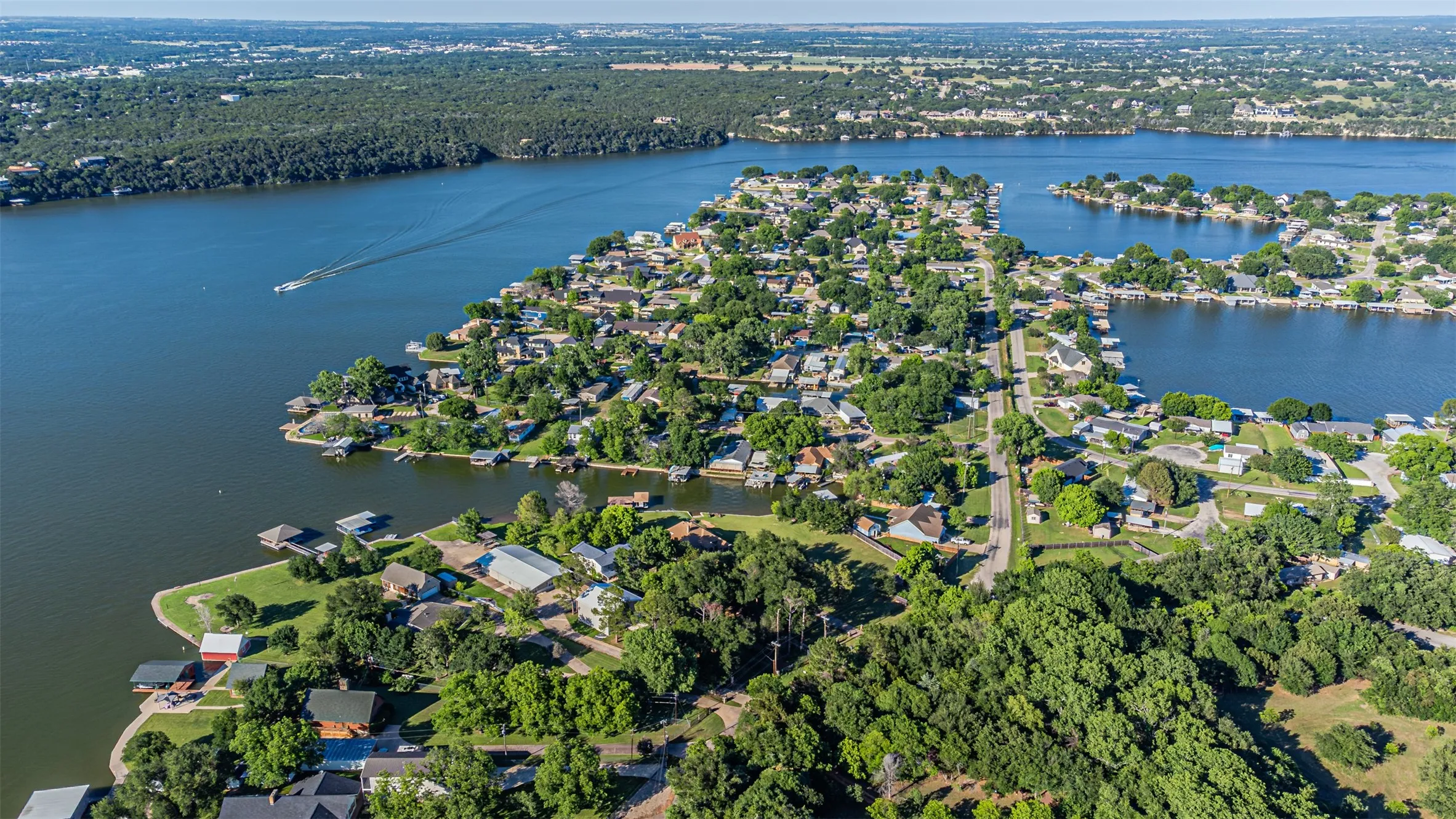Expansive waterfront community featuring numerous properties with private boat docks and direct lake access