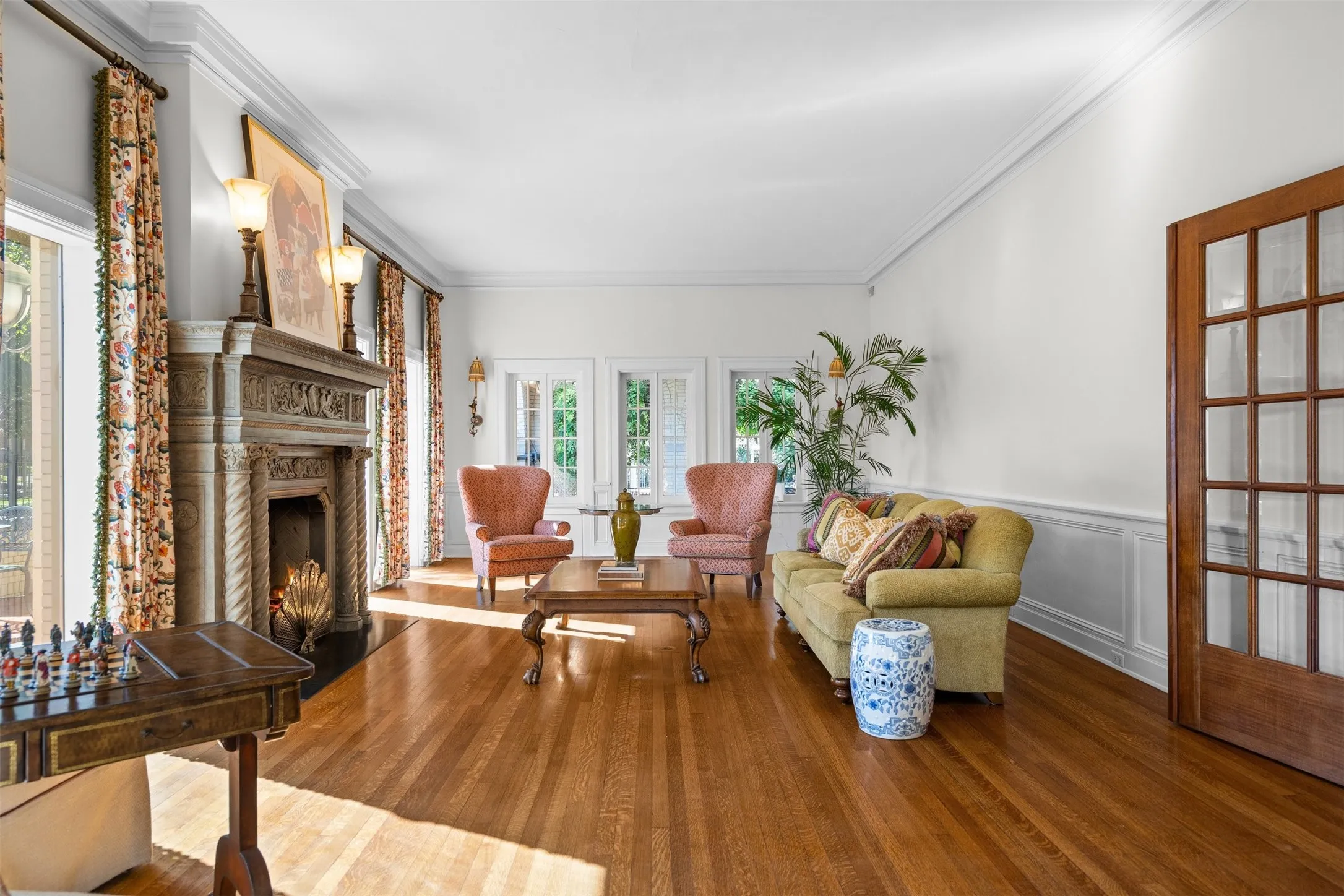 Gather with guests in the living room to unwind by the fireplace, enjoying cozy conversations and the warm, inviting ambiance.