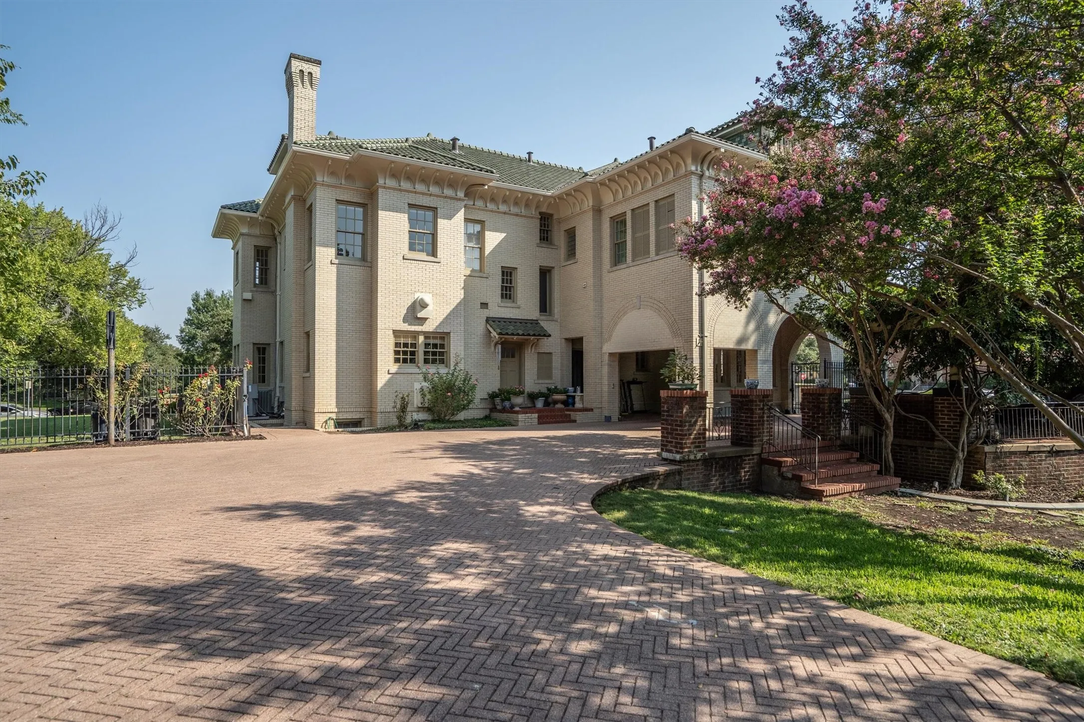This impressive home features a stately porte cochère and a spacious three-car garage, combining grand curb appeal with convenient,
elegant functionality.