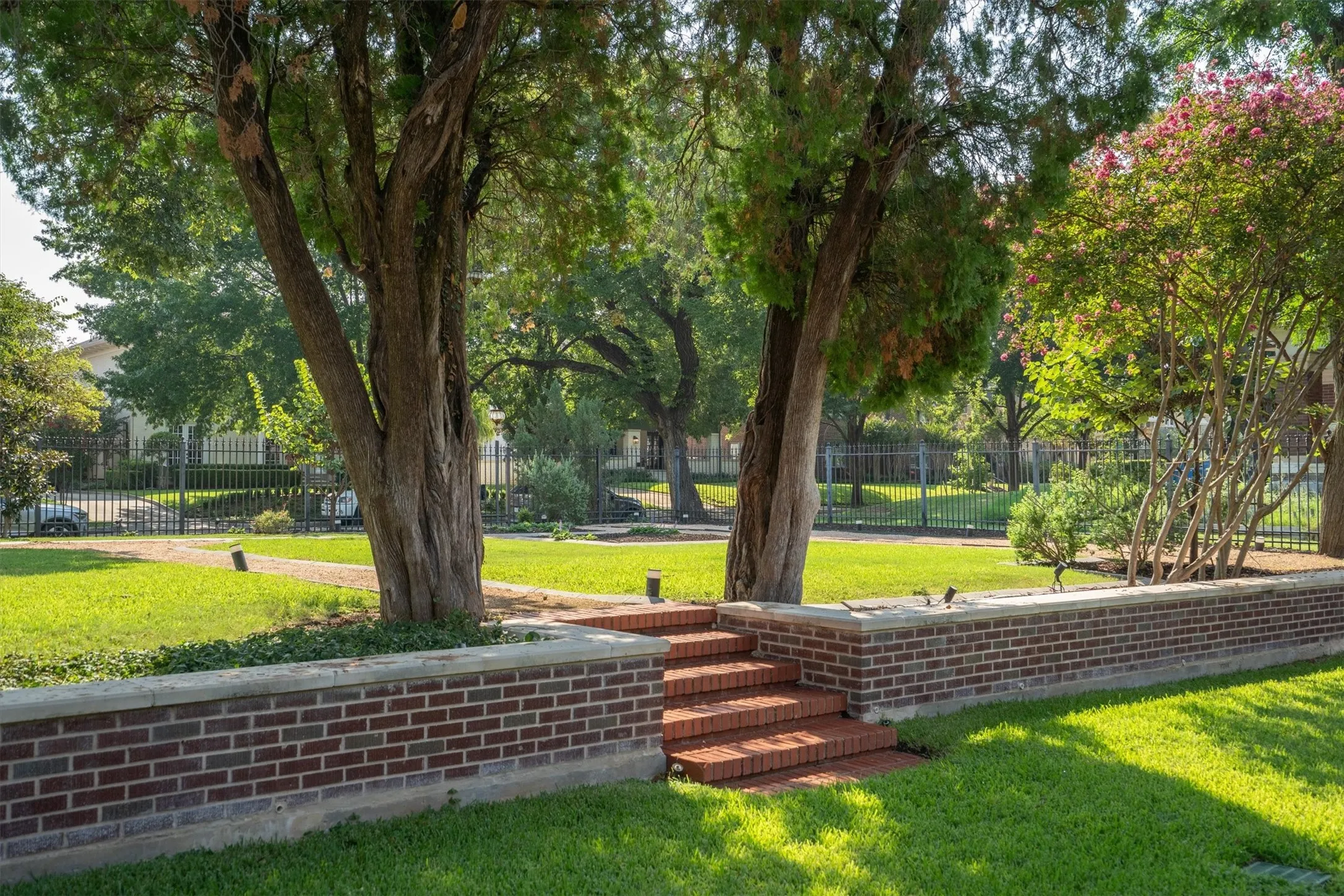 Spend your afternoons enjoying a game of Bocce Ball or playing croquet in this expansive, beautifully
landscaped oversized yard
