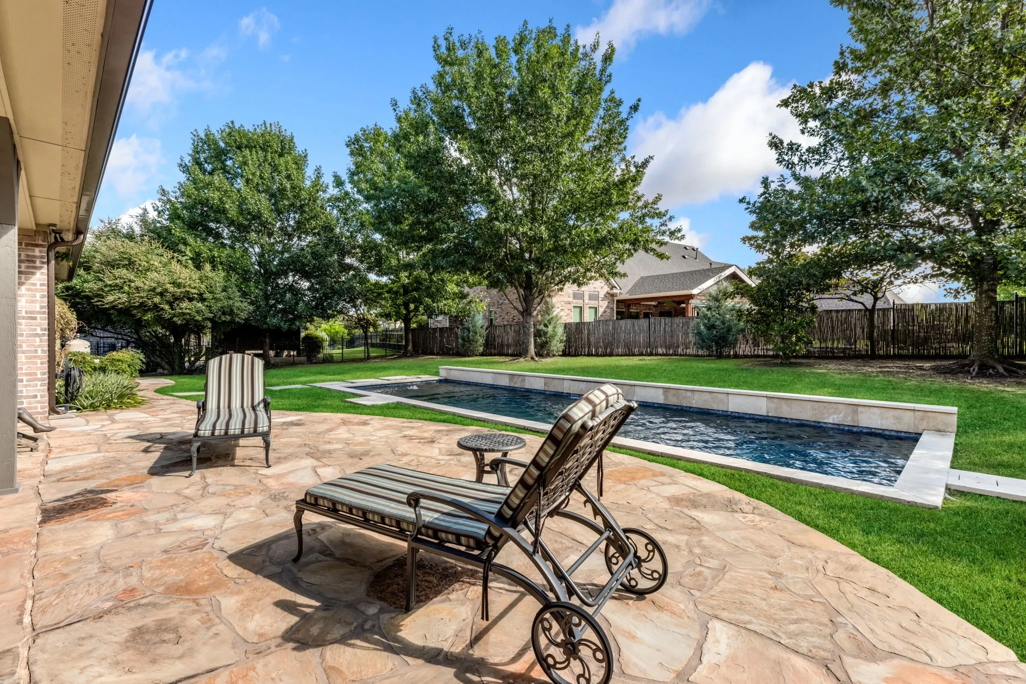 Fenced backyard featuring a patio