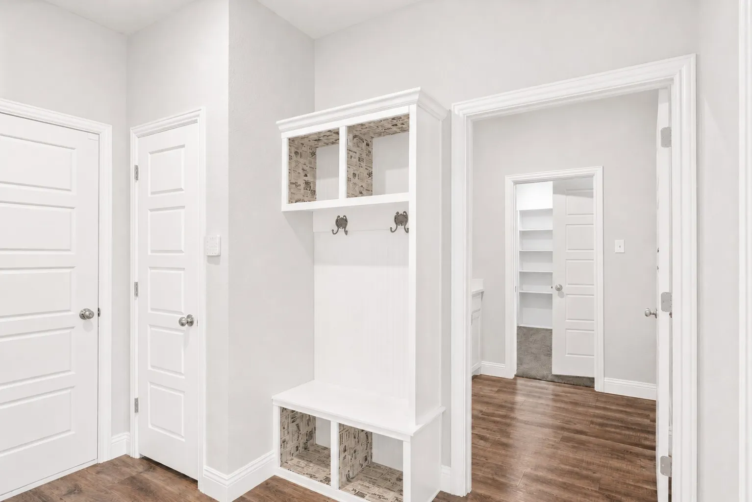 Some storage in mud room area off garage.