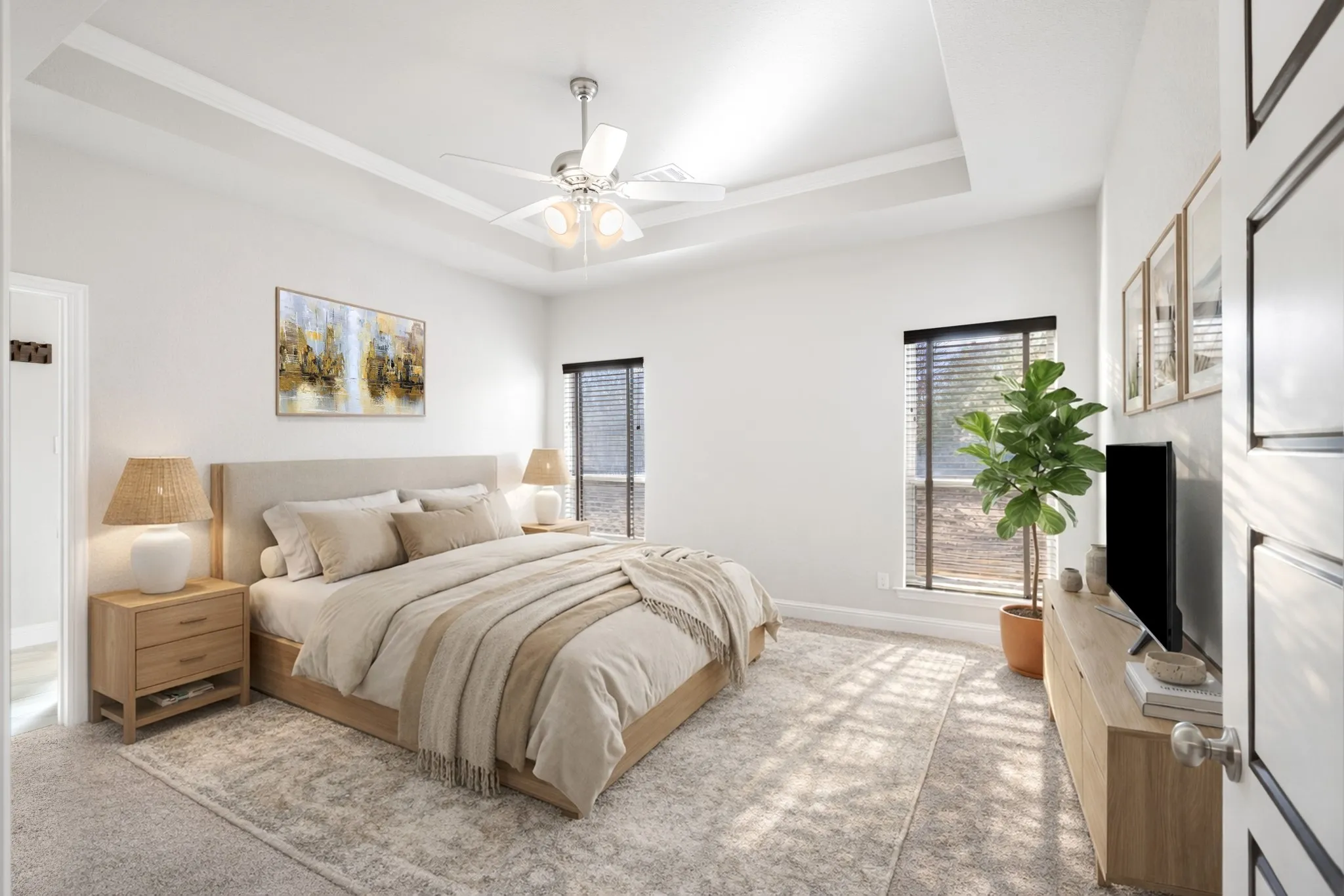 Primary bedroom with tray ceiling and separate from the other bedrooms.