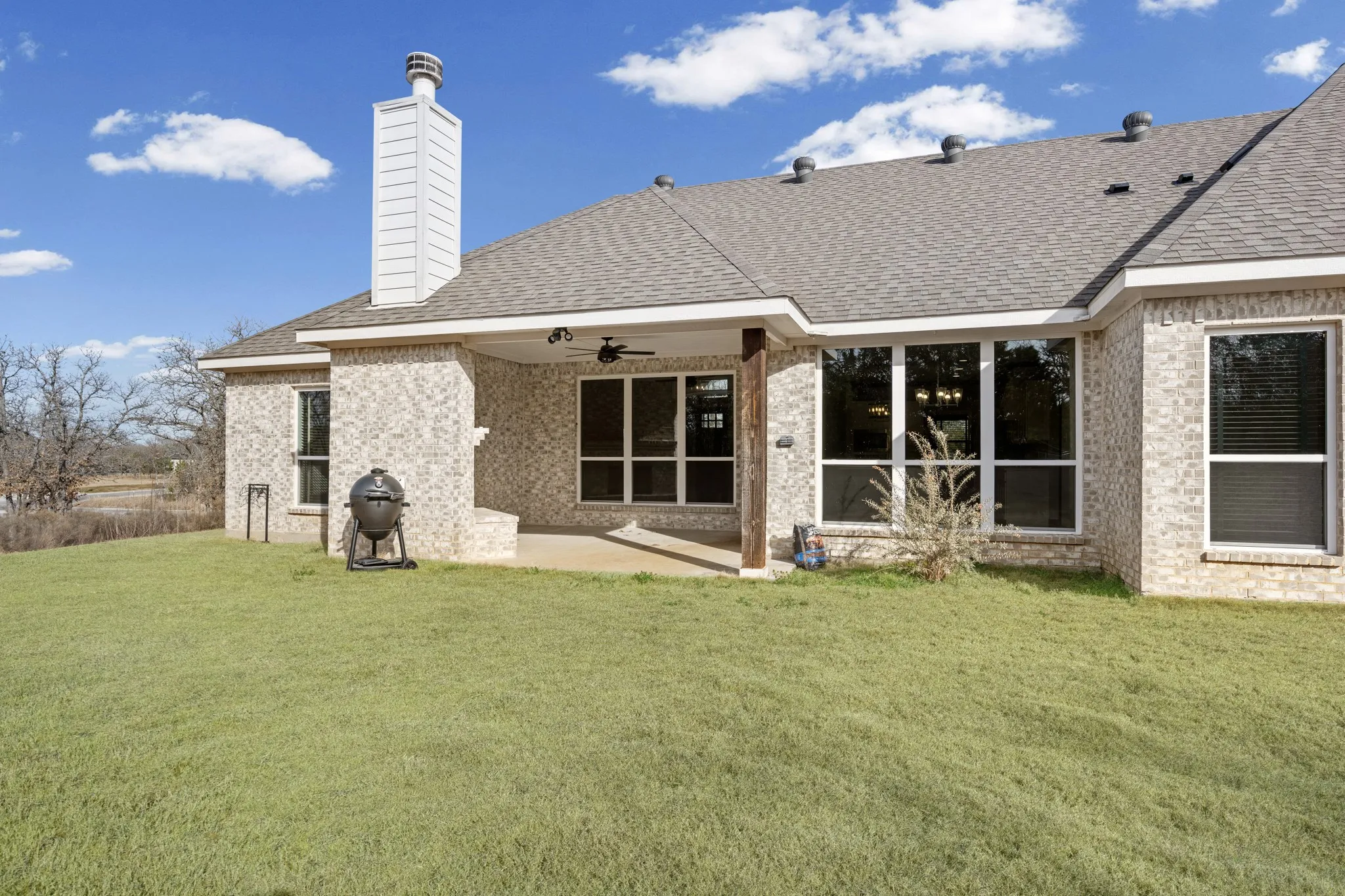 Covered back patio, with a fireplace. A great place to enjoy a cup of coffee in the morning or relax in the evening.