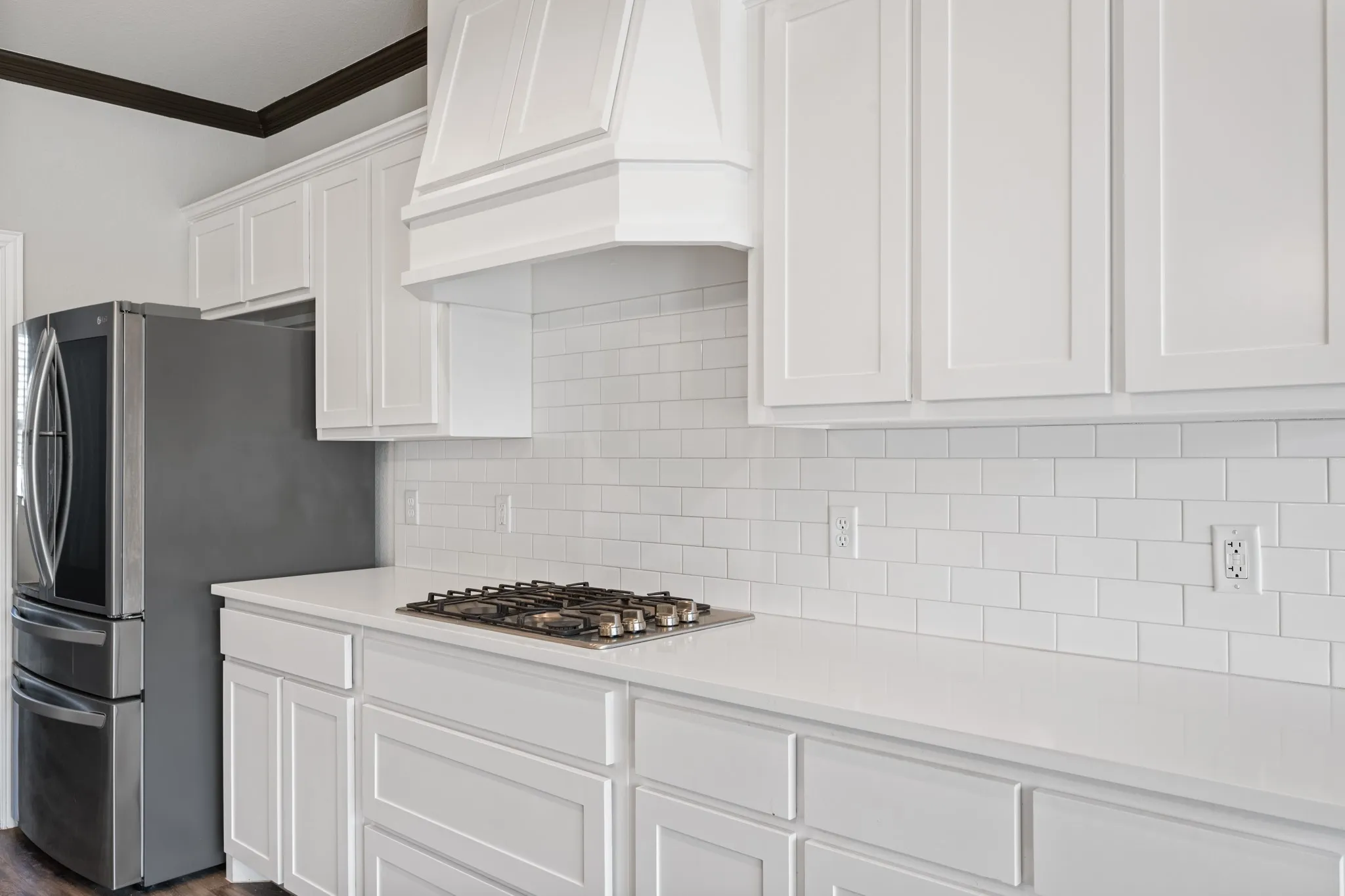 Cabinets, countertops and backsplash all compliment each other beautifully.