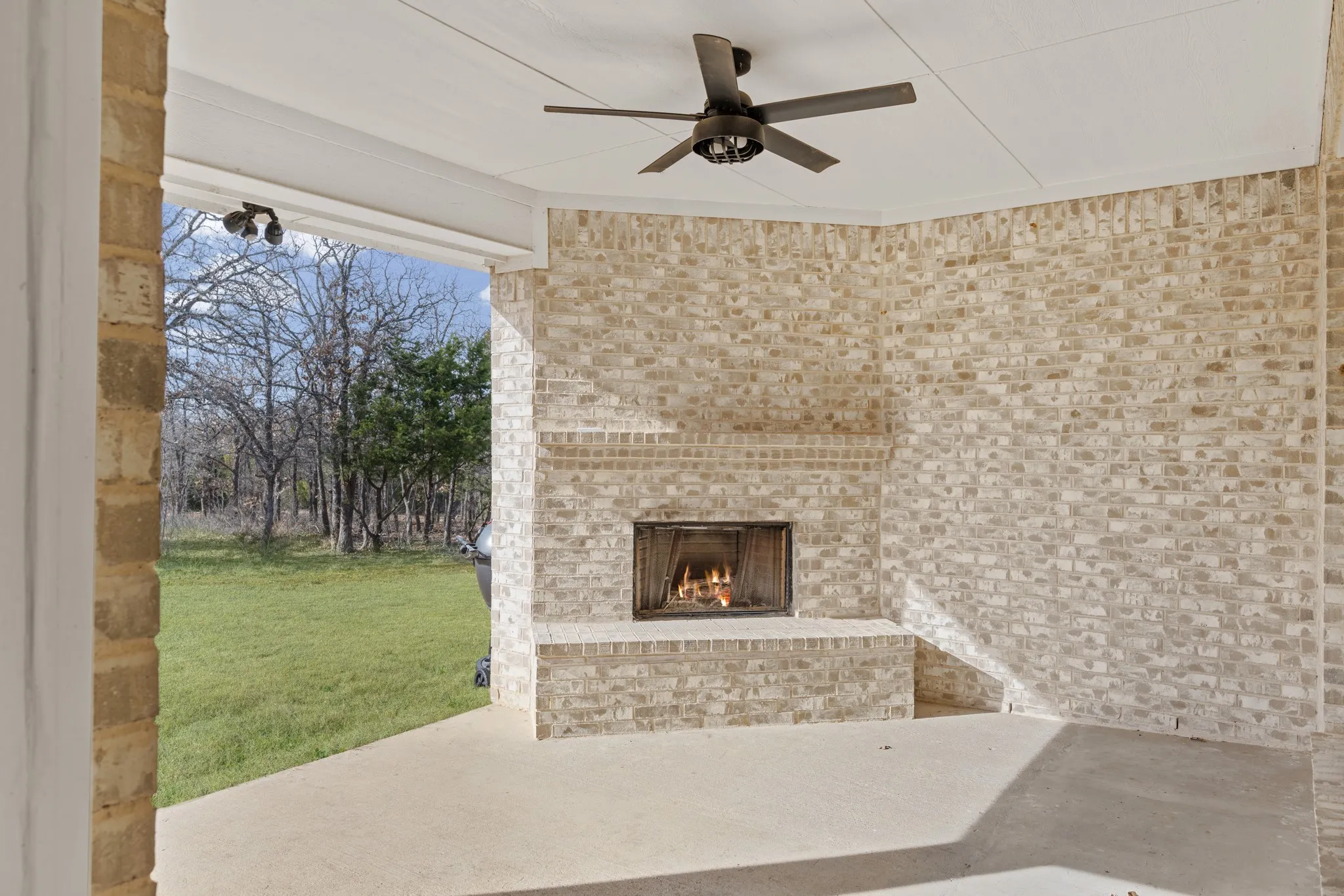 Covered patio with fireplace.