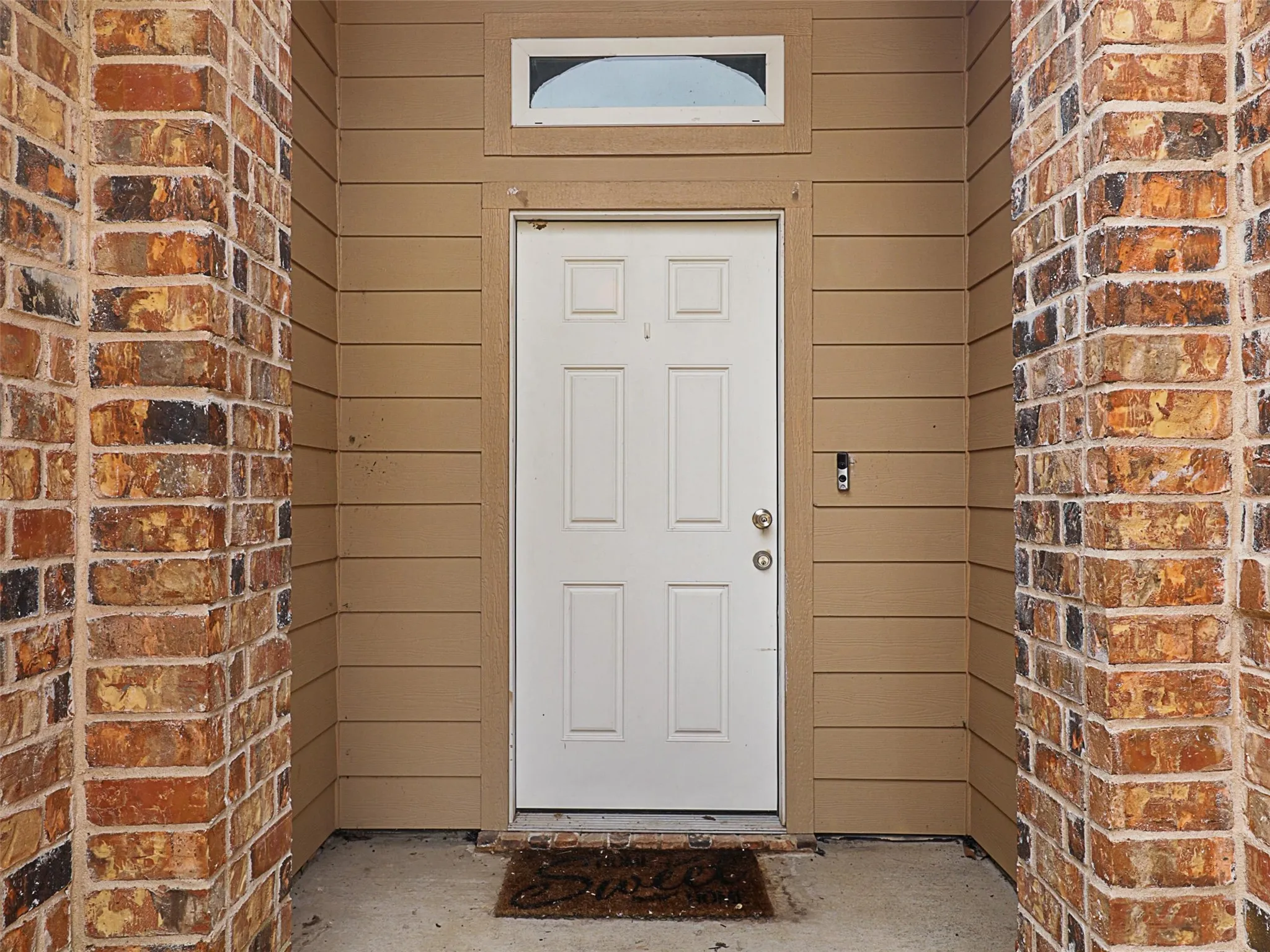 Property entrance with brick siding