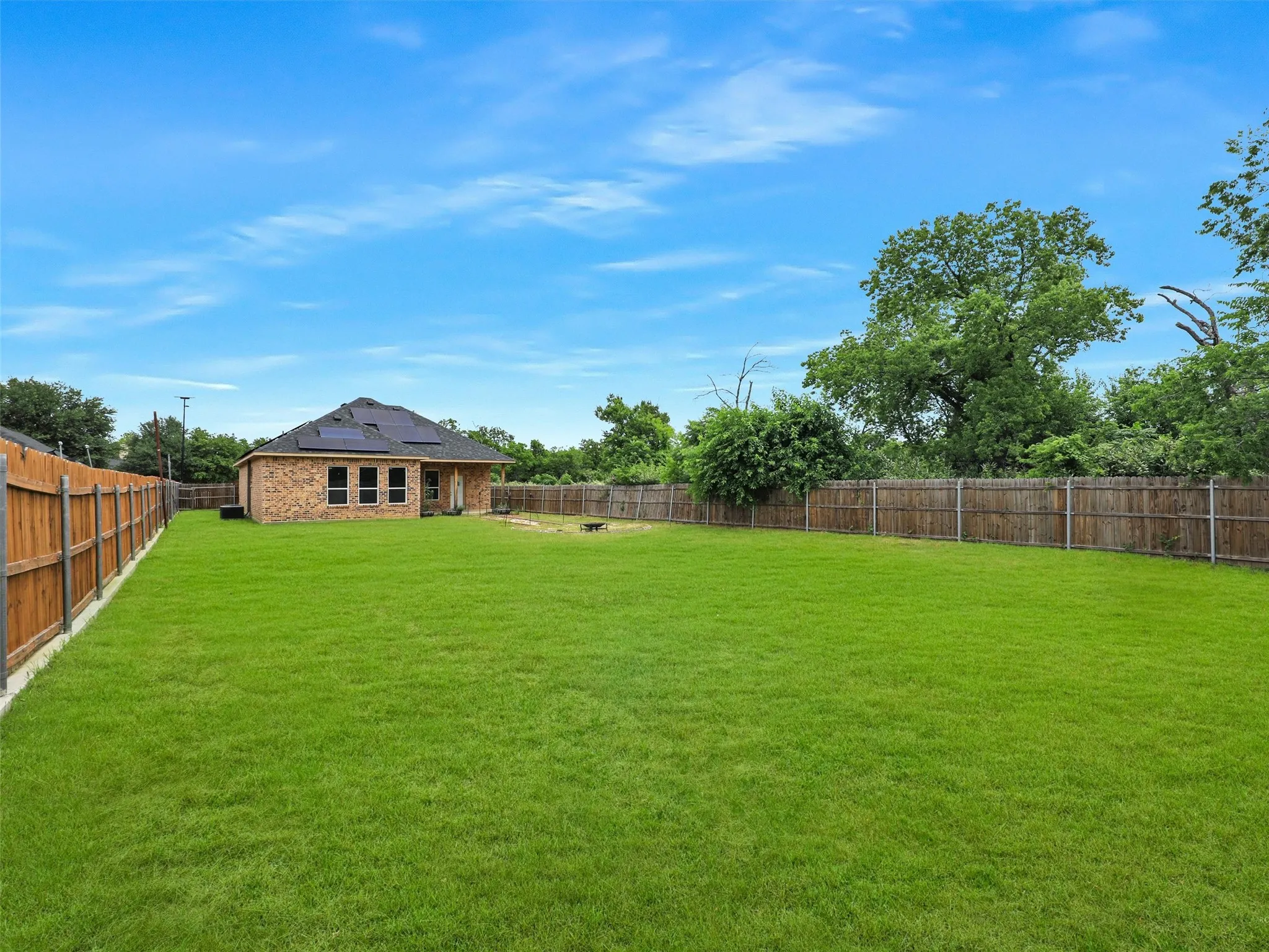 View of fenced backyard