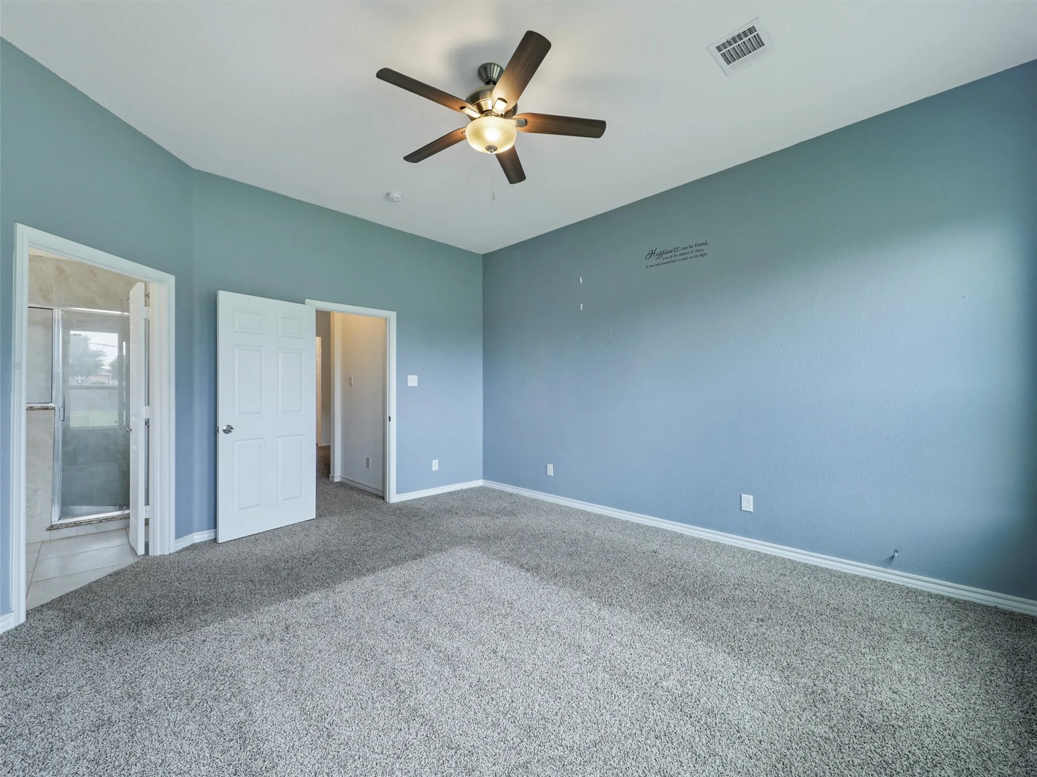 Unfurnished bedroom featuring carpet and ceiling fan