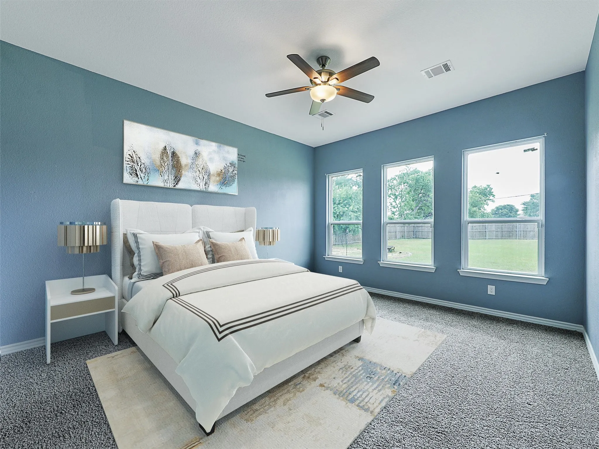 Carpeted bedroom with baseboards and a ceiling fan