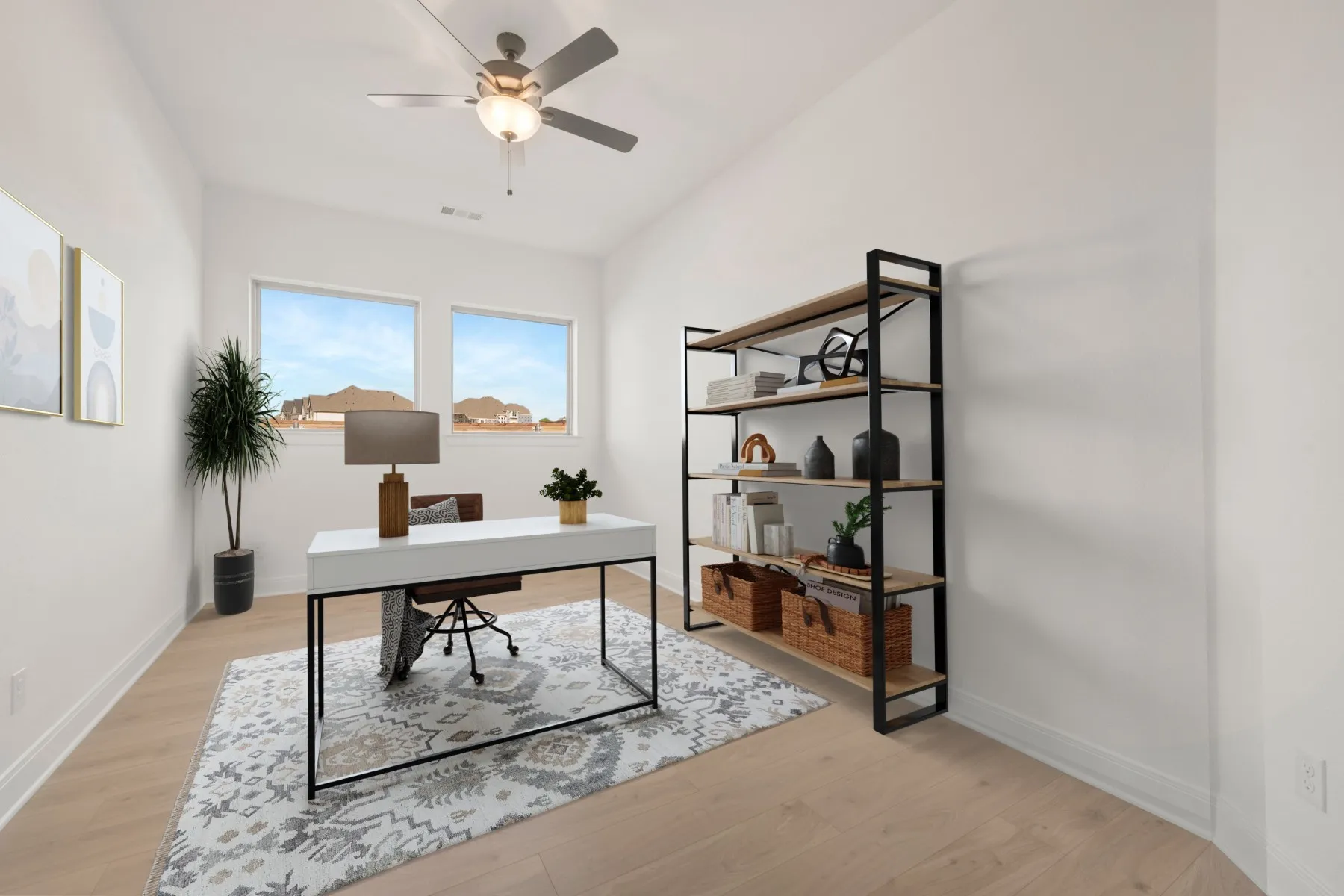 Dedicated interior space featuring wood-finish flooring and a contemporary ceiling fan