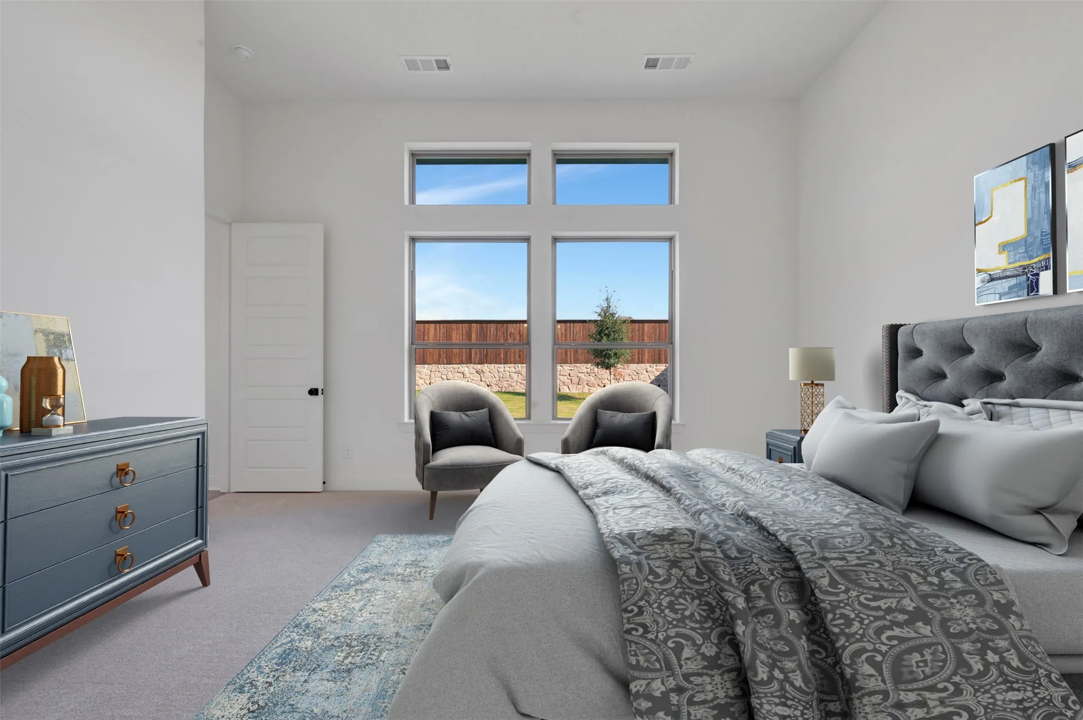 Floor-to-ceiling windows featuring a wood fence, high ceilings, recessed lighting, and light grey carpeting