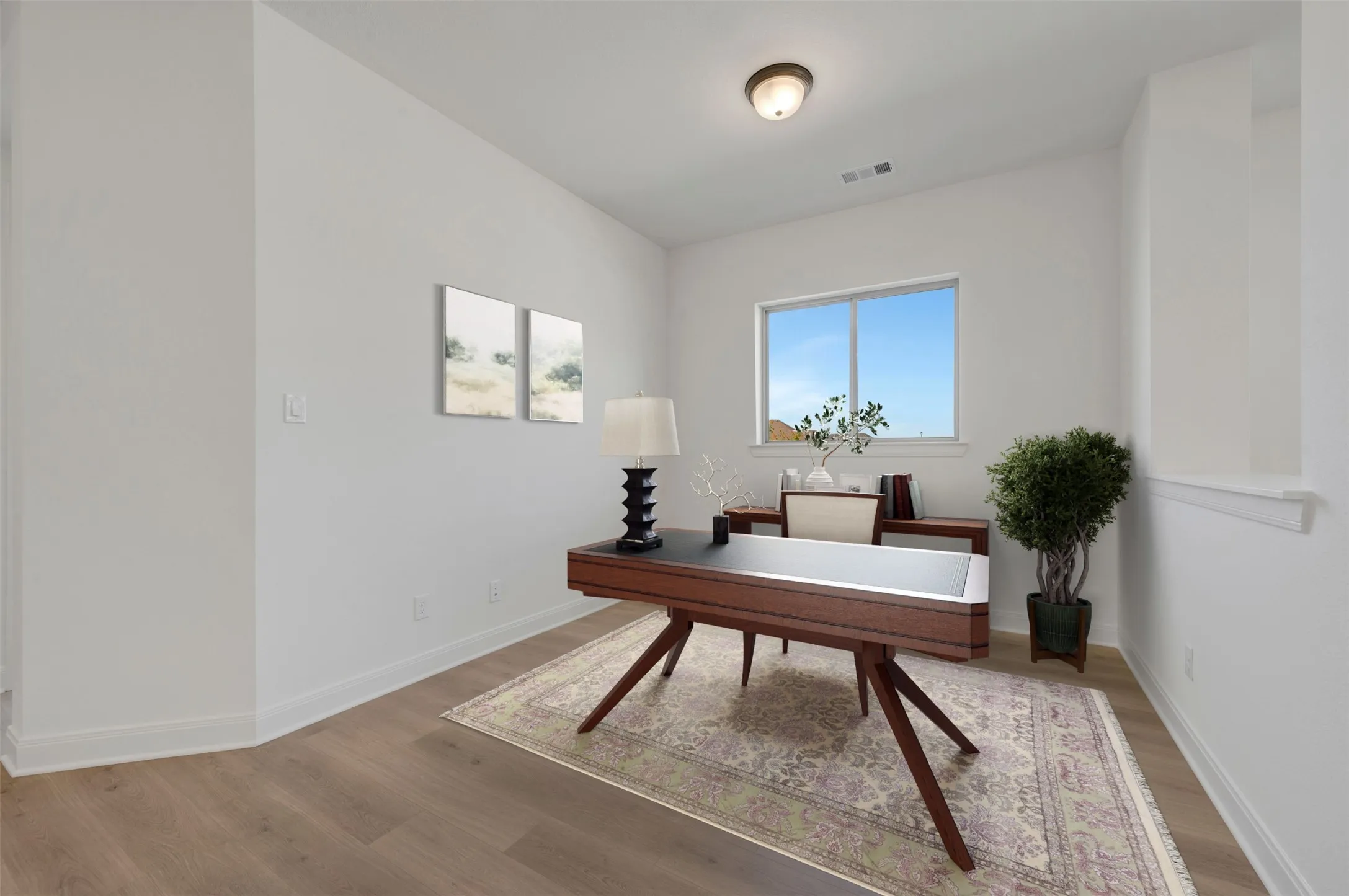 Bright room featuring wood-finish flooring, a large window, white walls, and a ceiling-mounted light fixture