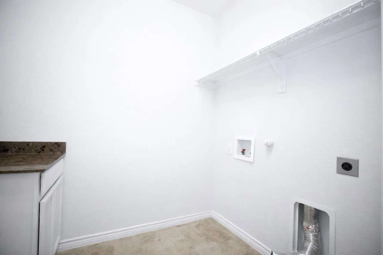 Laundry room featuring hookup for a gas dryer, hookup for a washing machine, and hookup for an electric dryer