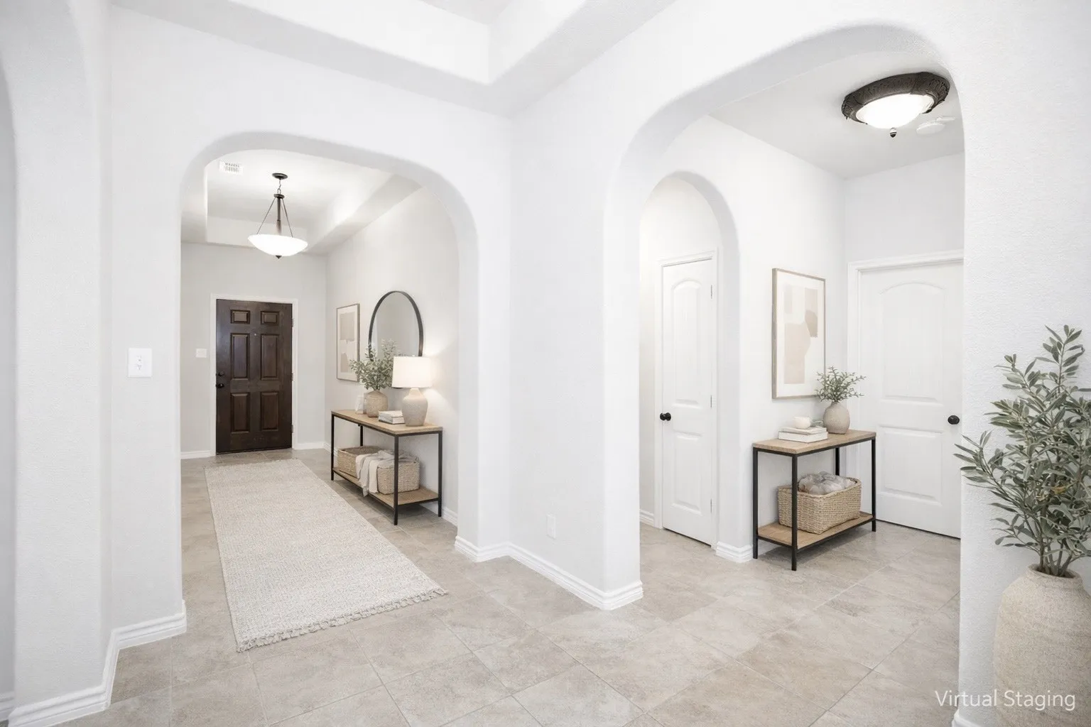 Virtual Staged Foyer entrance with a tray ceiling and arched walkways