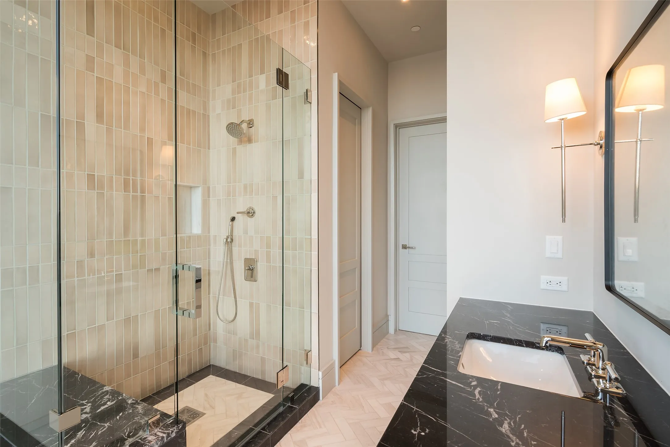 Bathroom with a shower stall and vanity