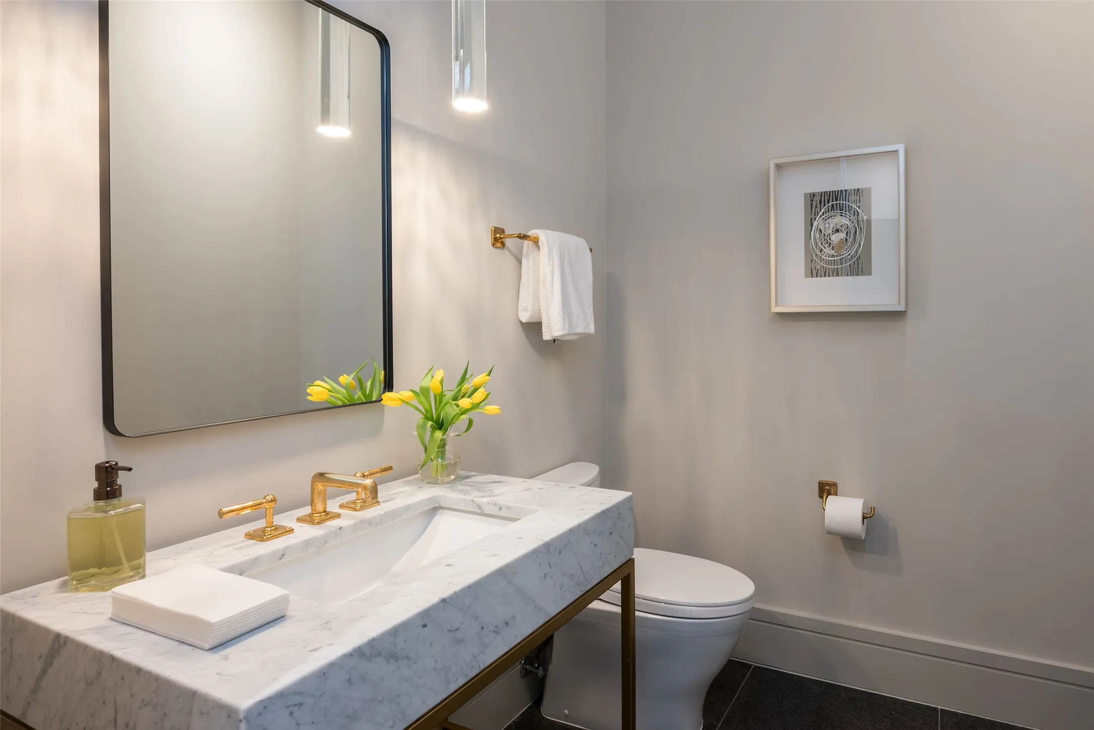 Half bathroom featuring tile patterned flooring and vanity