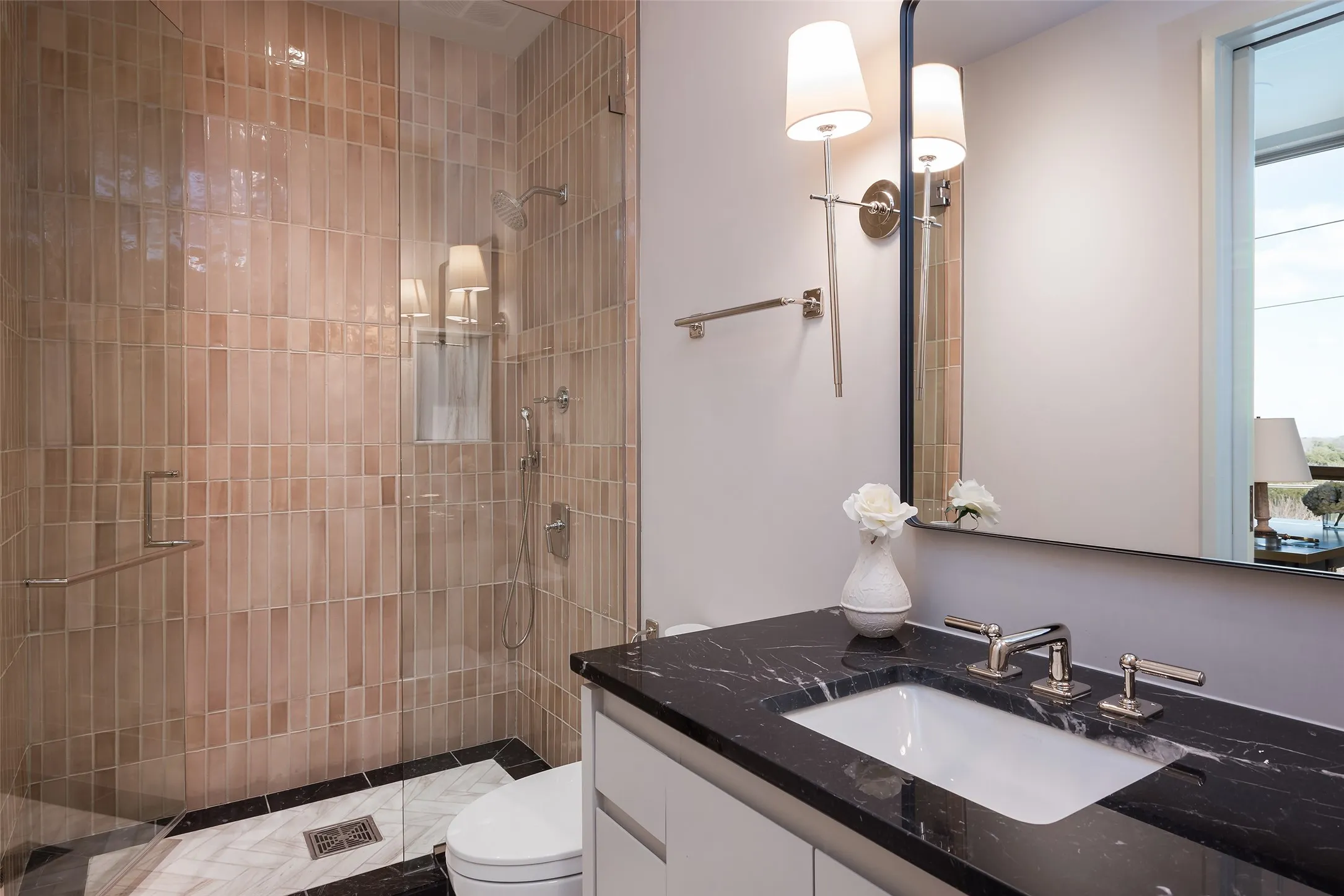 Bathroom featuring vanity and a shower stall