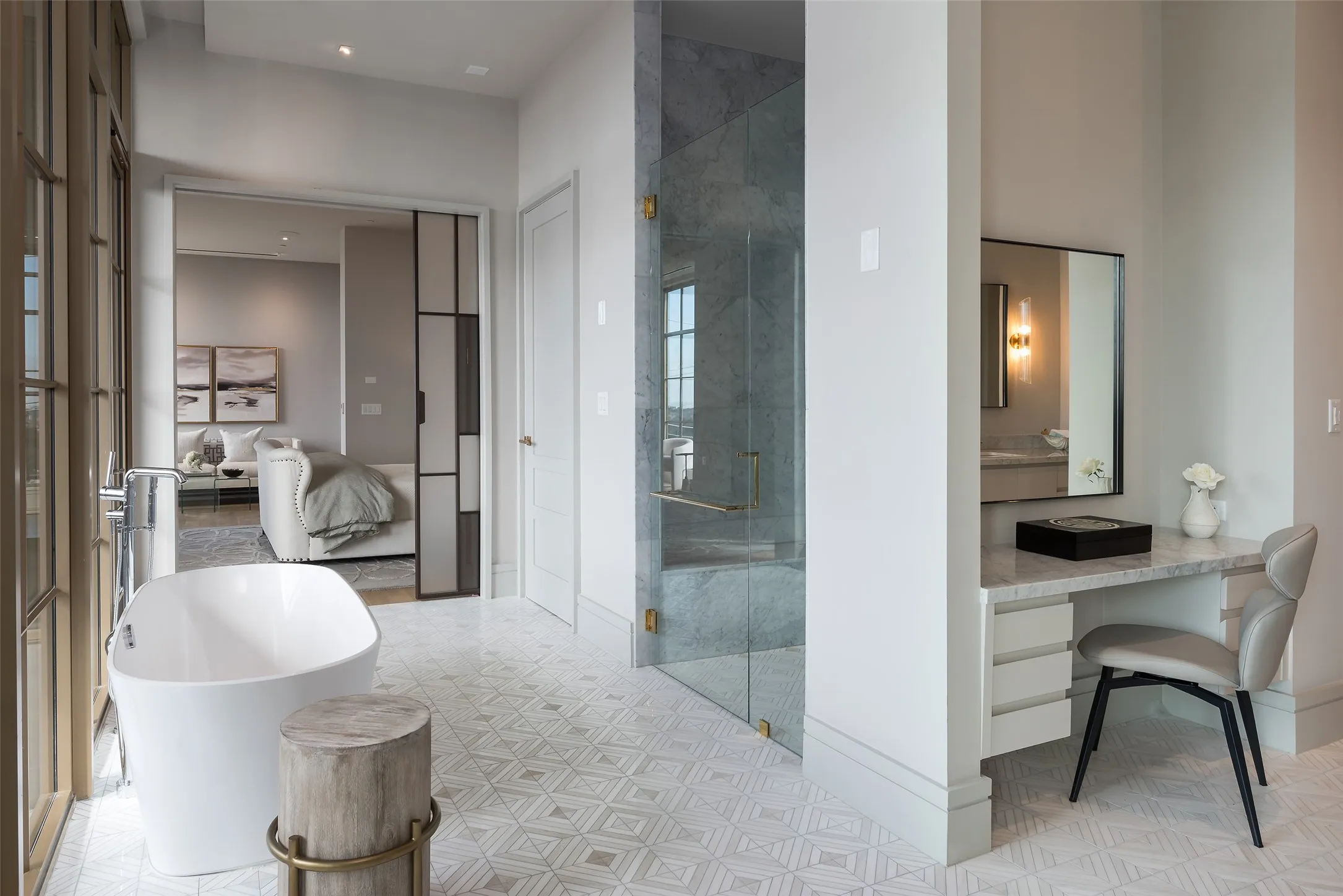 Ensuite bathroom with a shower stall, a freestanding bath, light flooring, and vanity