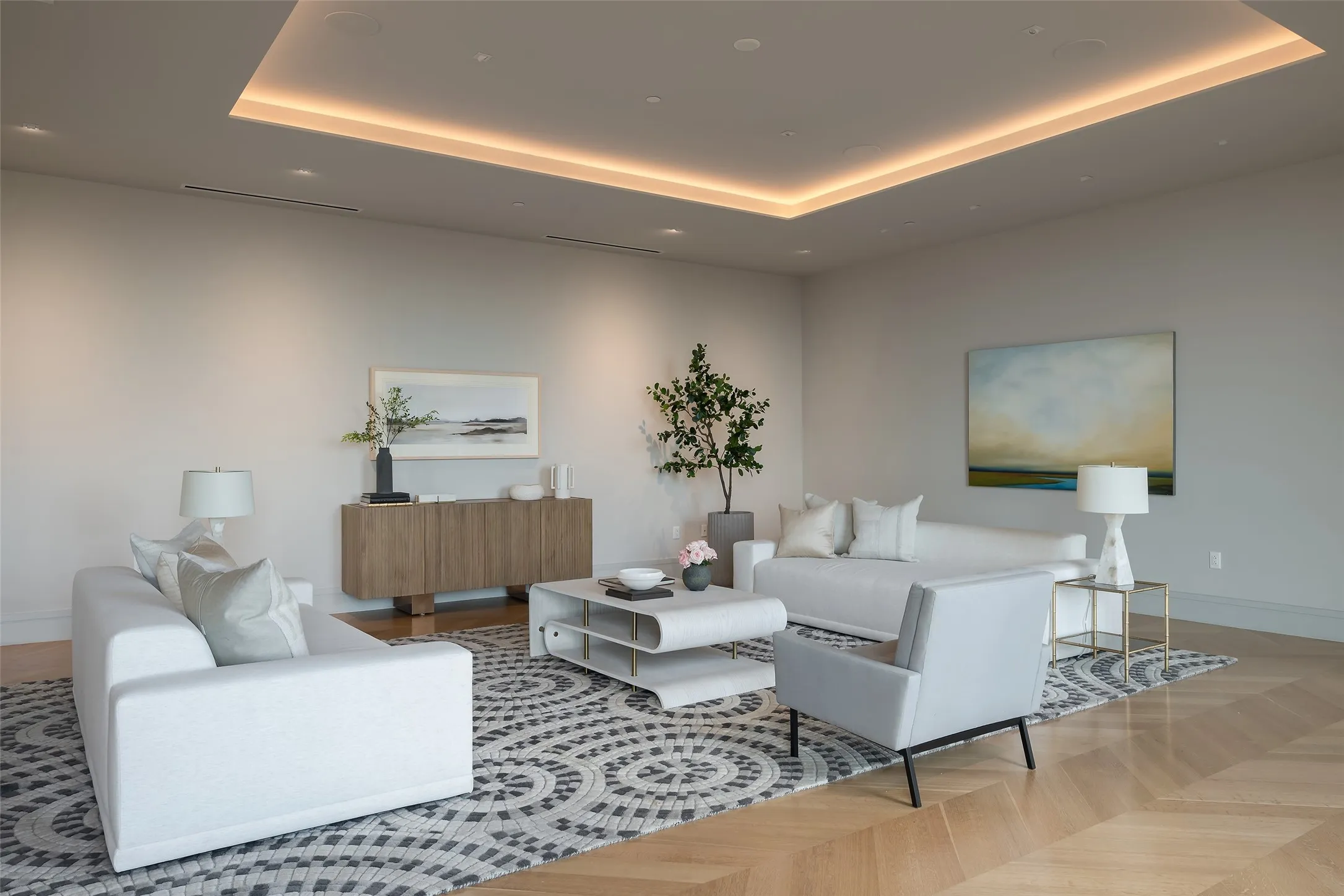 Living area with parquet floors and a raised ceiling