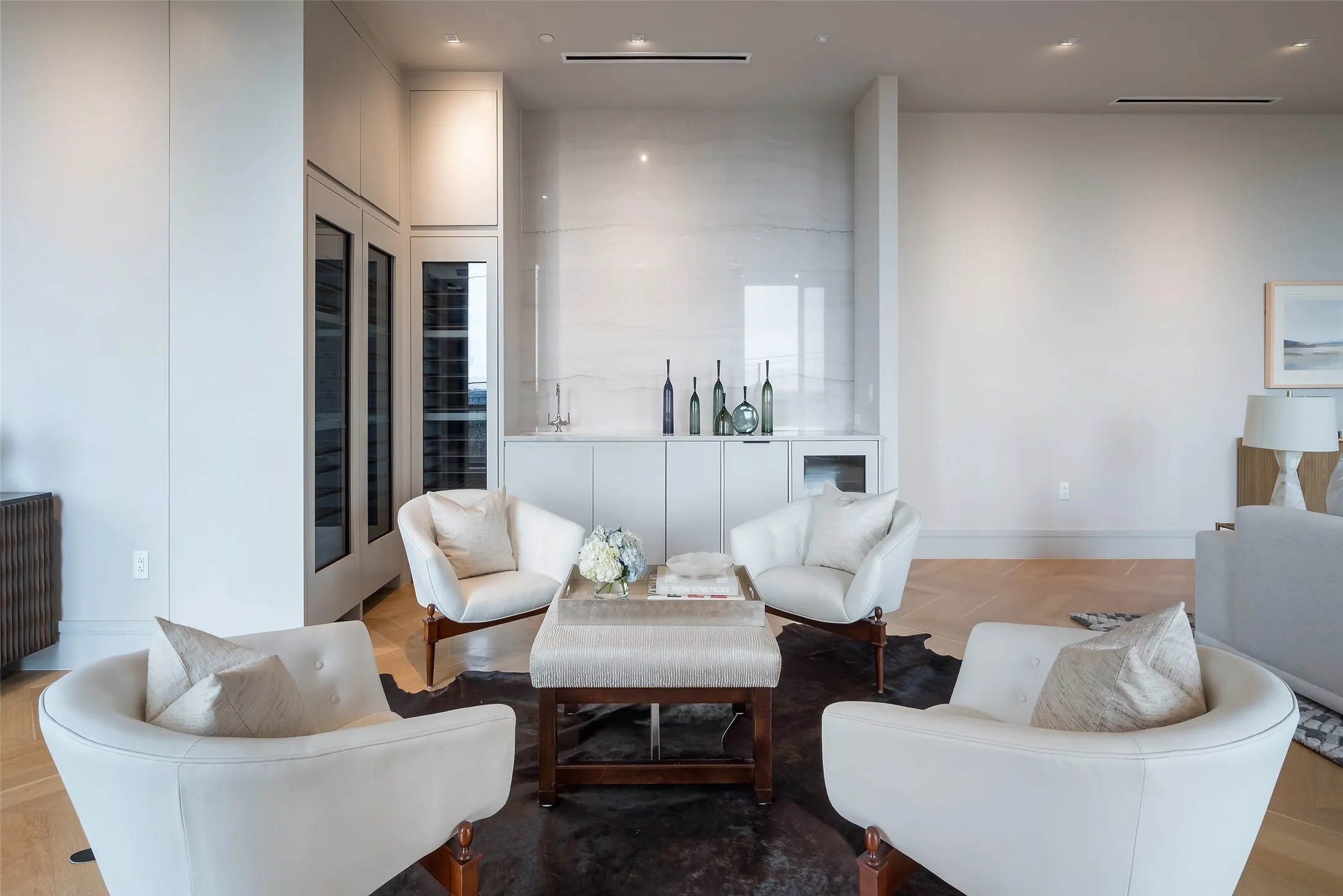 Living room featuring parquet flooring and recessed lighting