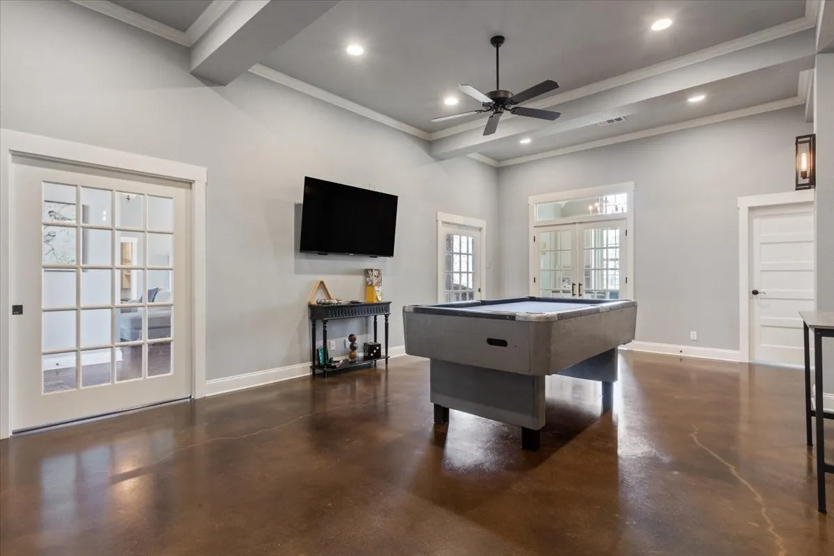 Rec room with french doors, finished concrete floors, ceiling fan, billiards, and recessed lighting