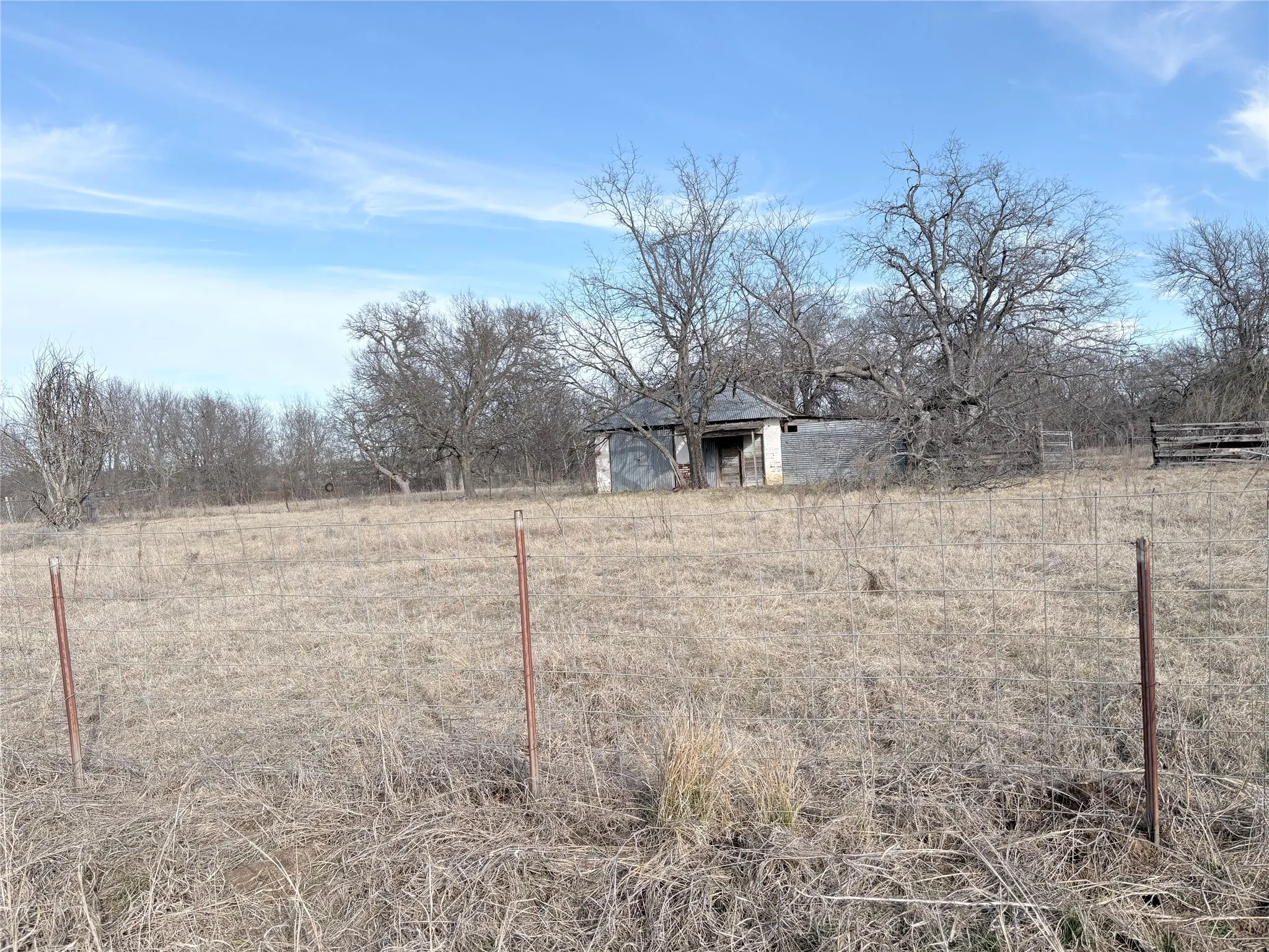 View of yard featuring a view of countryside and an outdoor structure