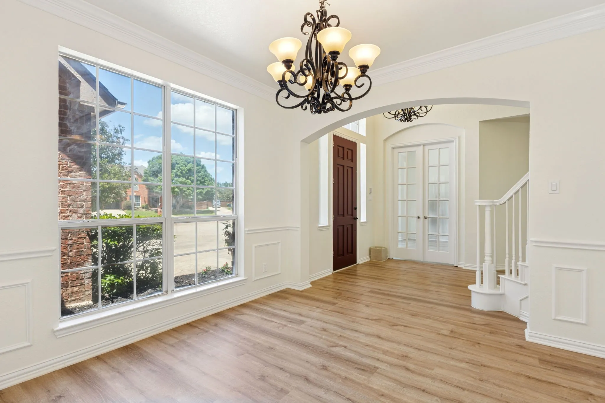This is your formal dinning room. Large enough for a big formal table or you can lift the light and make it a formal livingroom.