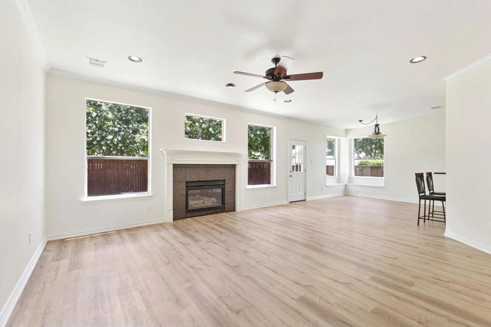 Welcome to your bright, relaxing living room with a gas log fireplace.