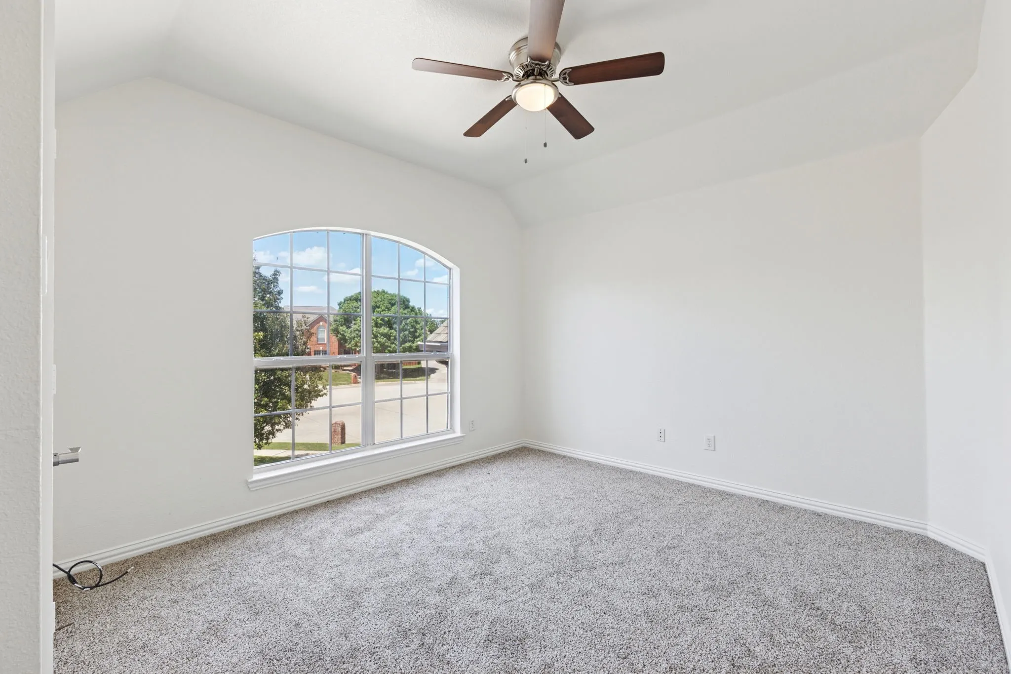 Upstairs bedroom is overlooking the front yard, The fresh paint and window gives this room so much natural light.