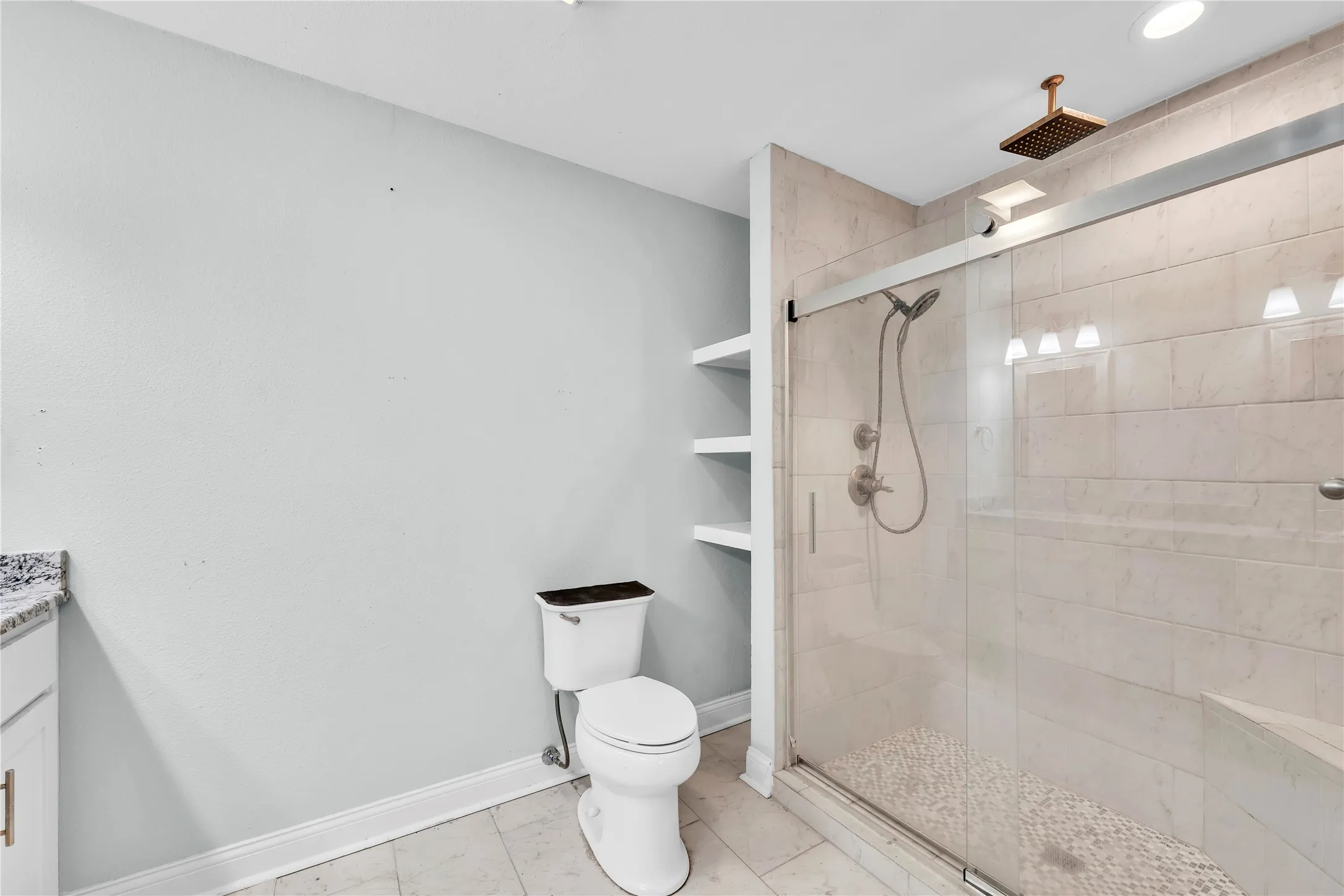 Master bath featuring vanity, a shower stall