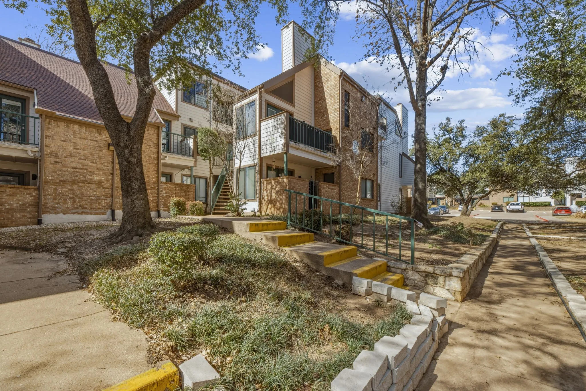 View of apartment building / complex with stairs