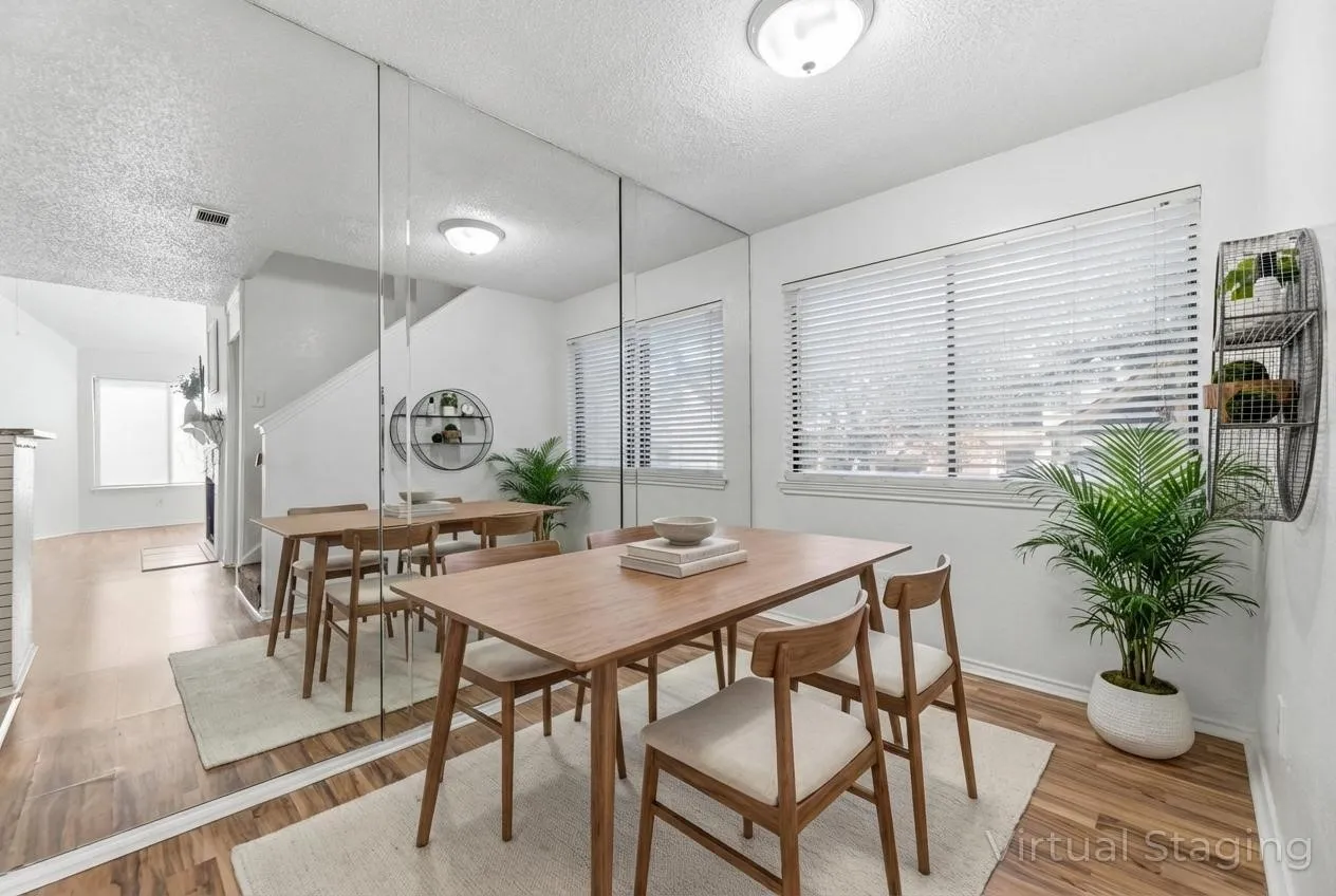 Dining room featuring a textured ceiling and light wood-style floors