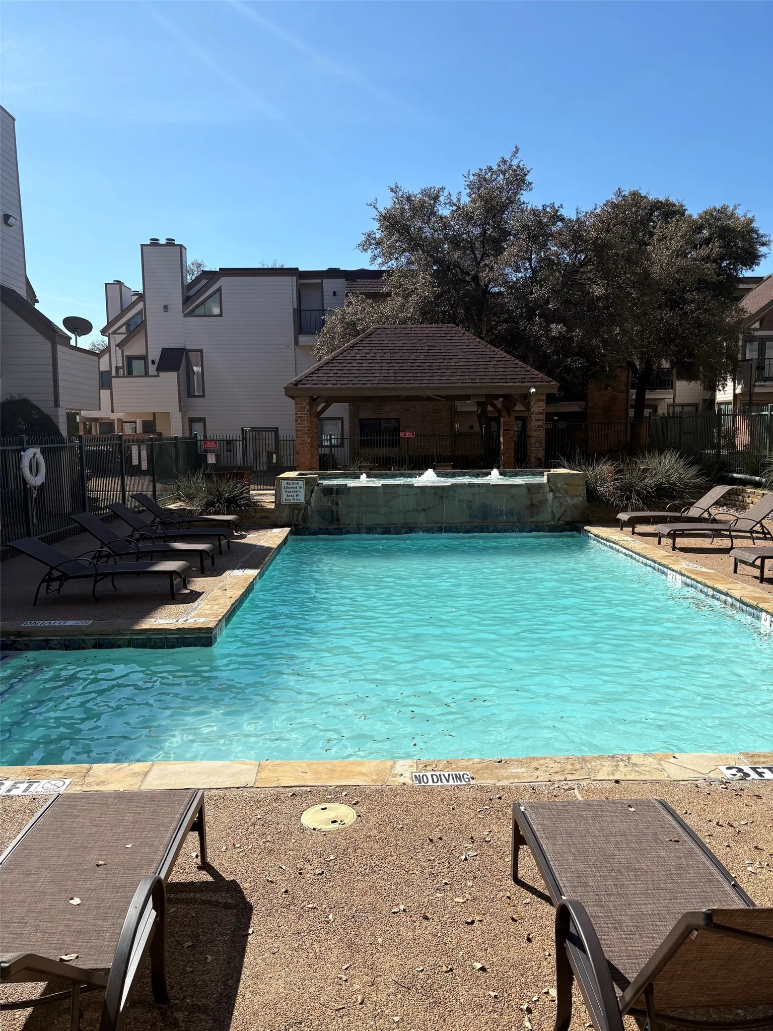 Community pool featuring a patio area
