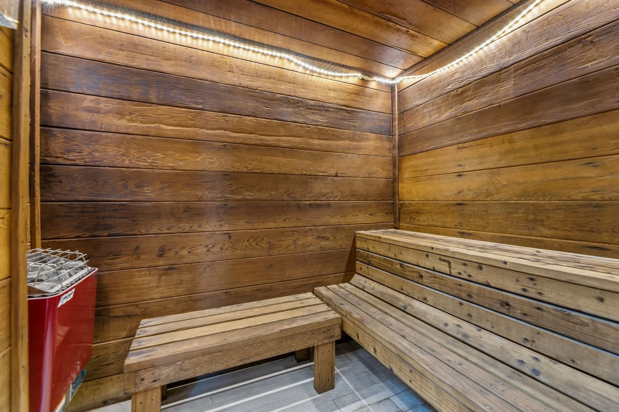 Relaxing sauna / steam room featuring wooden walls and wood ceiling