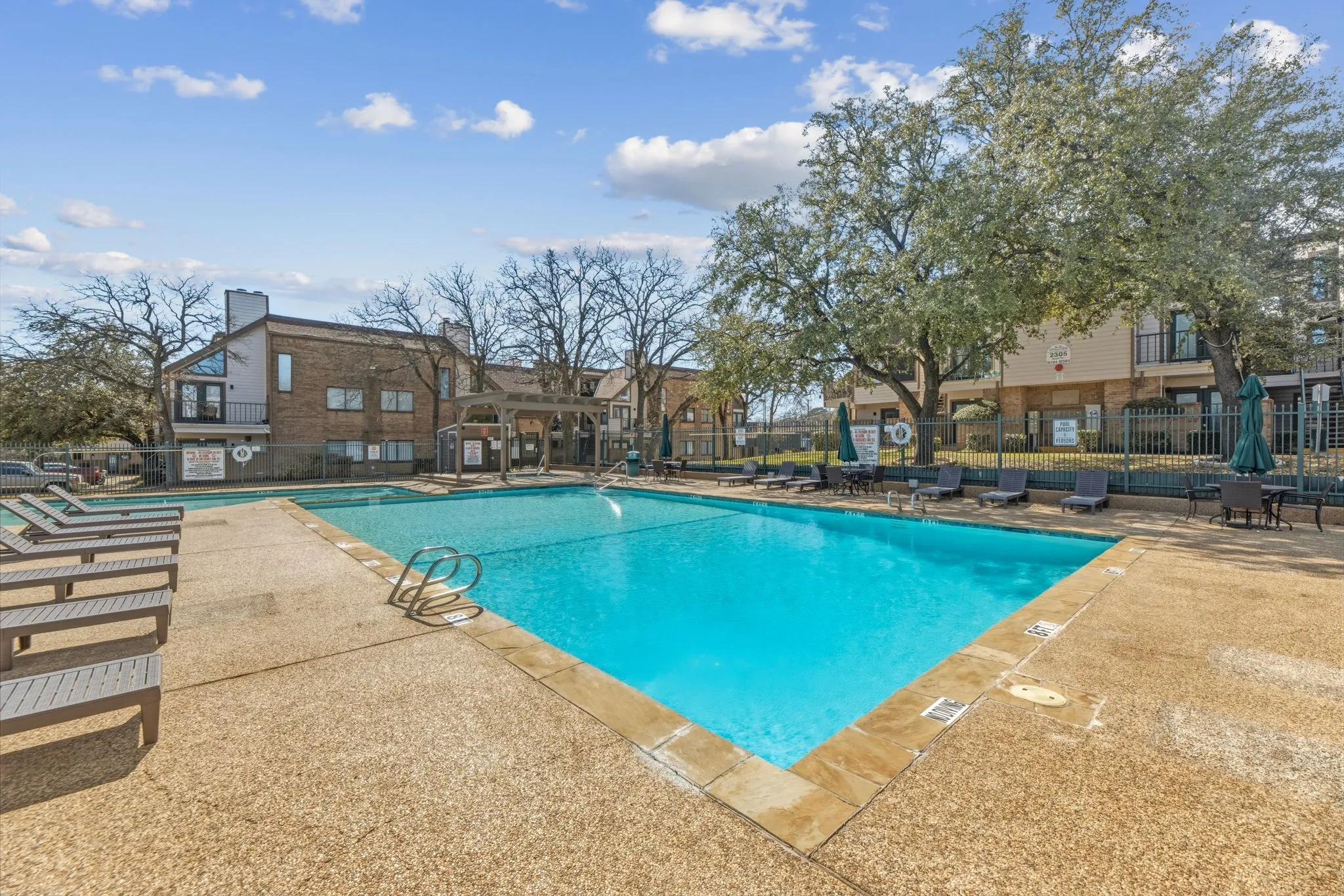 Community pool featuring a patio