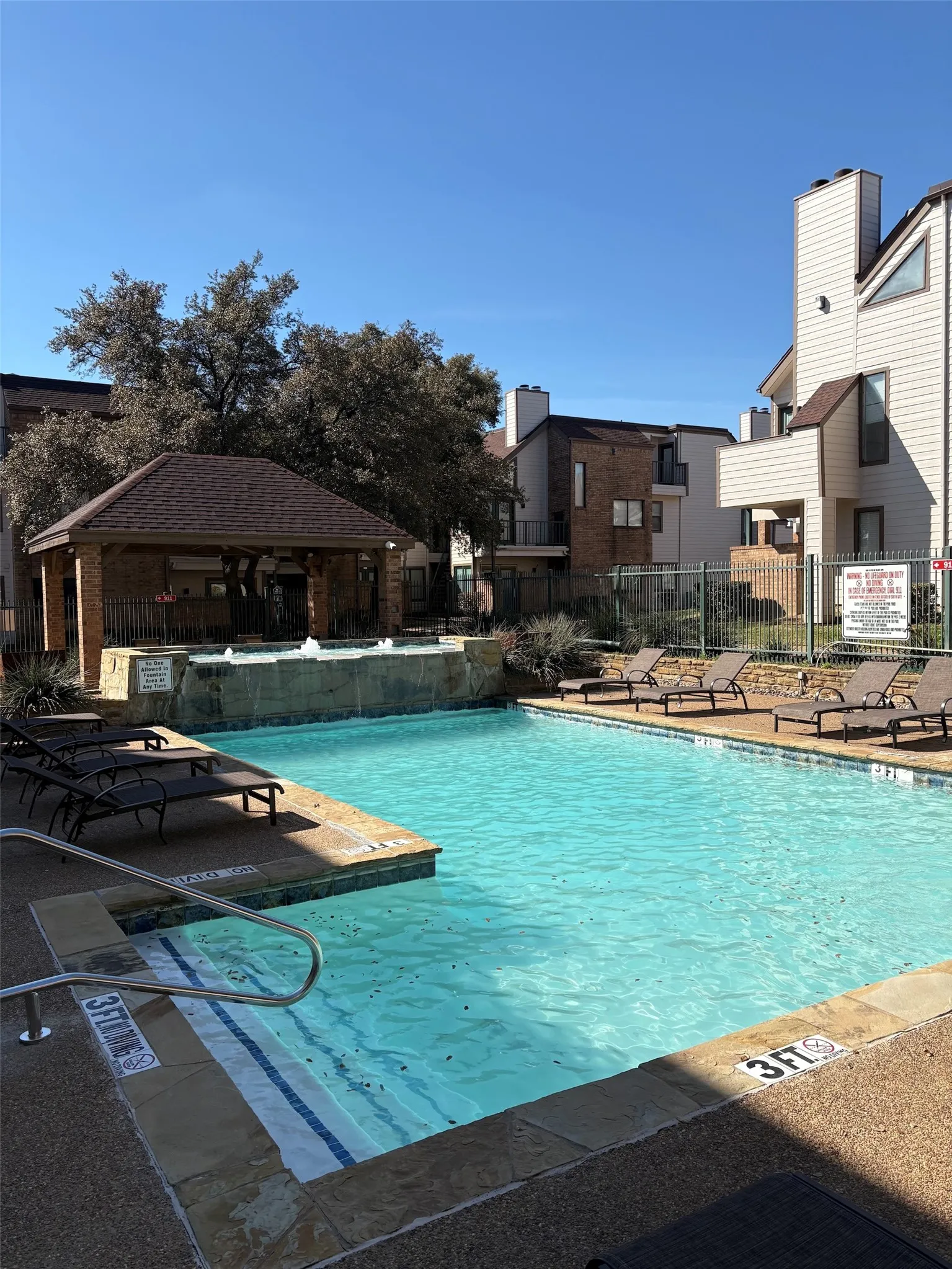Community pool with a patio area